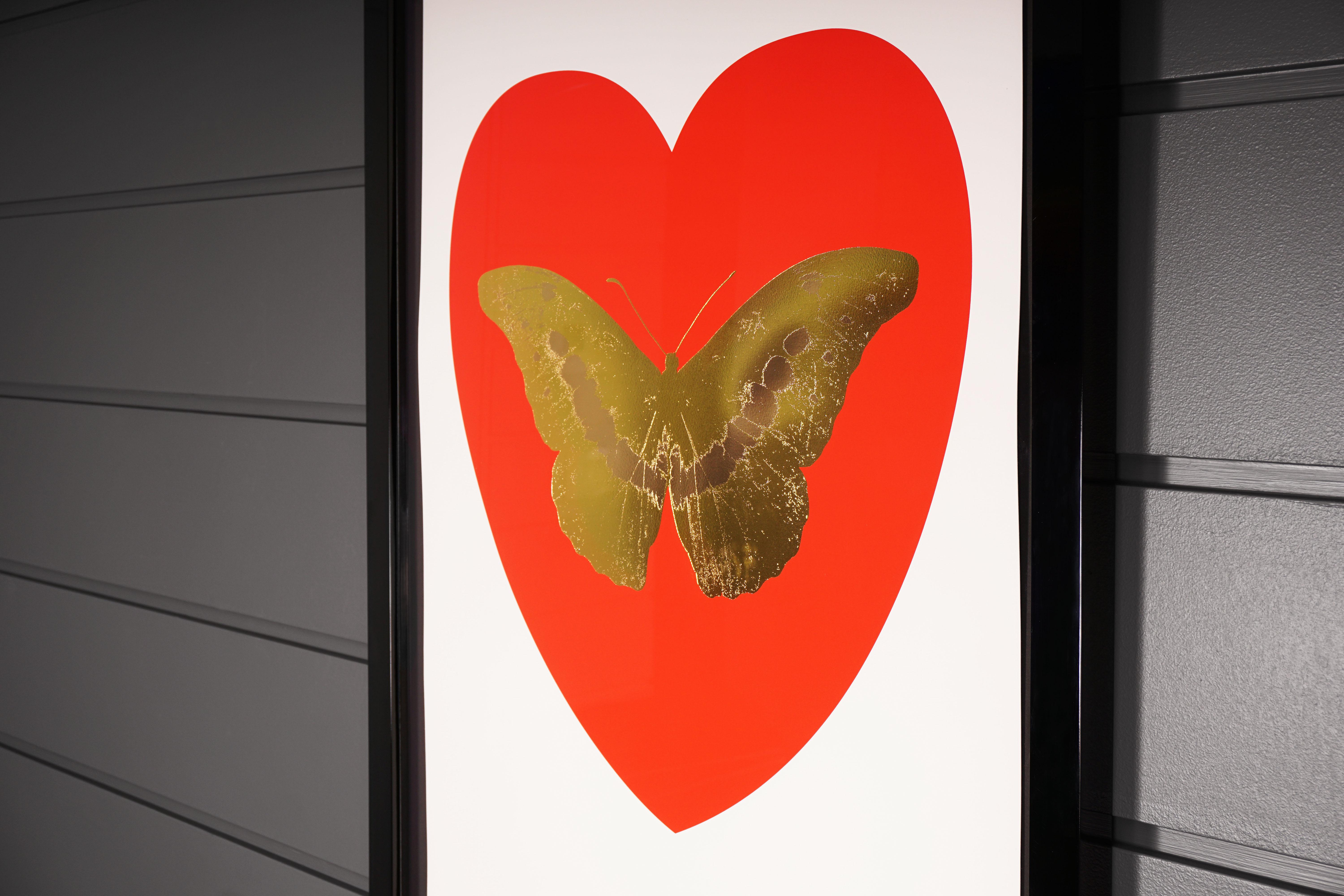 This Artwork is a part of the limited edition series 'I Love You' by Damien Hirst. Created in Hirst's signature style using butterflies as a symbolism for the celebration of life. This particular work features a foil-block butterfly surrounded by a