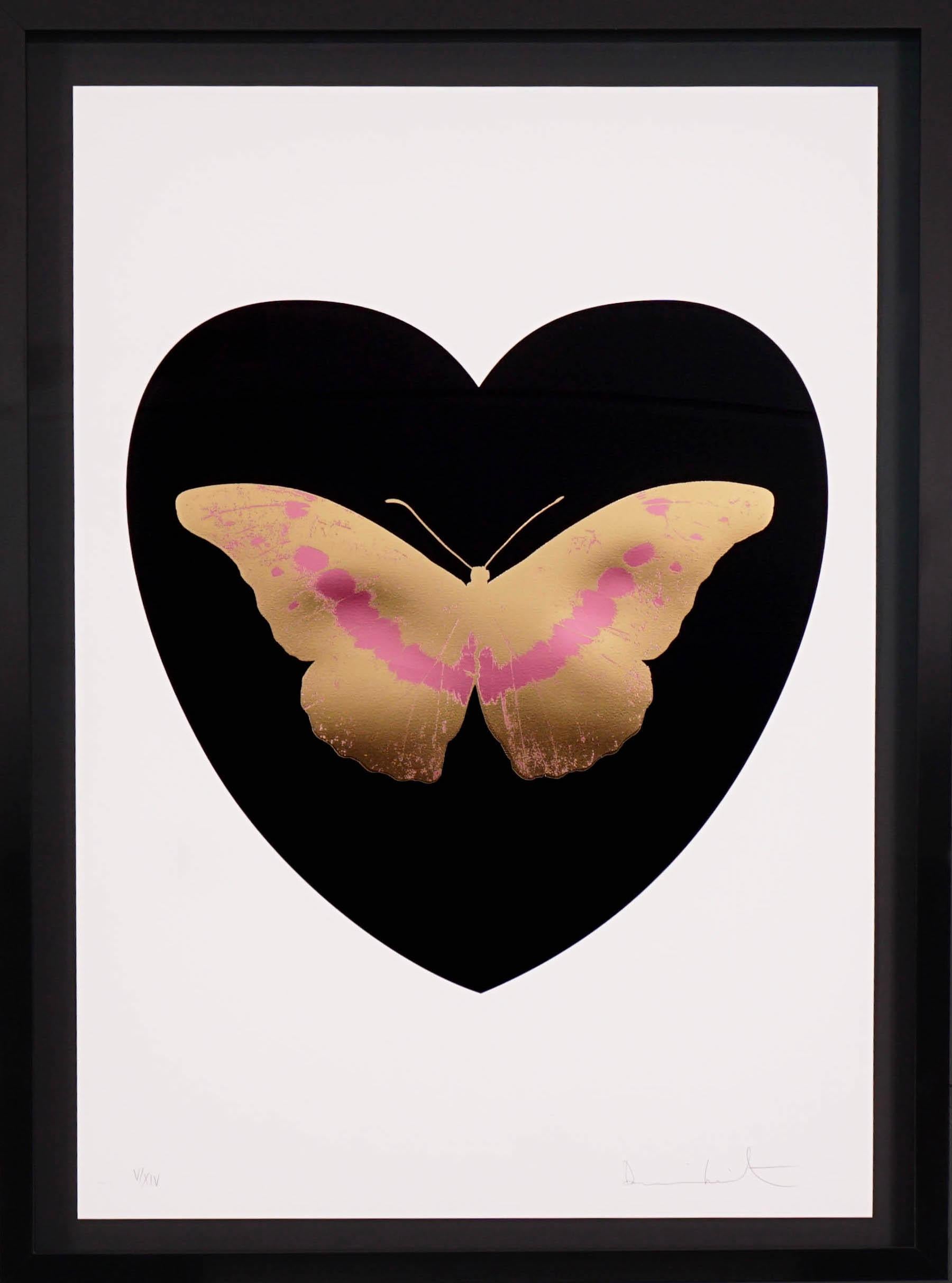The 'I Love You' Butterfly in black, coral, and gold color scheme is a limited edition silkscreen print by Damien Hirst. This uplifting and pop art work features a gilded 24K gold leaf butterfly with coral detailing, surrounded by a jet balck heart