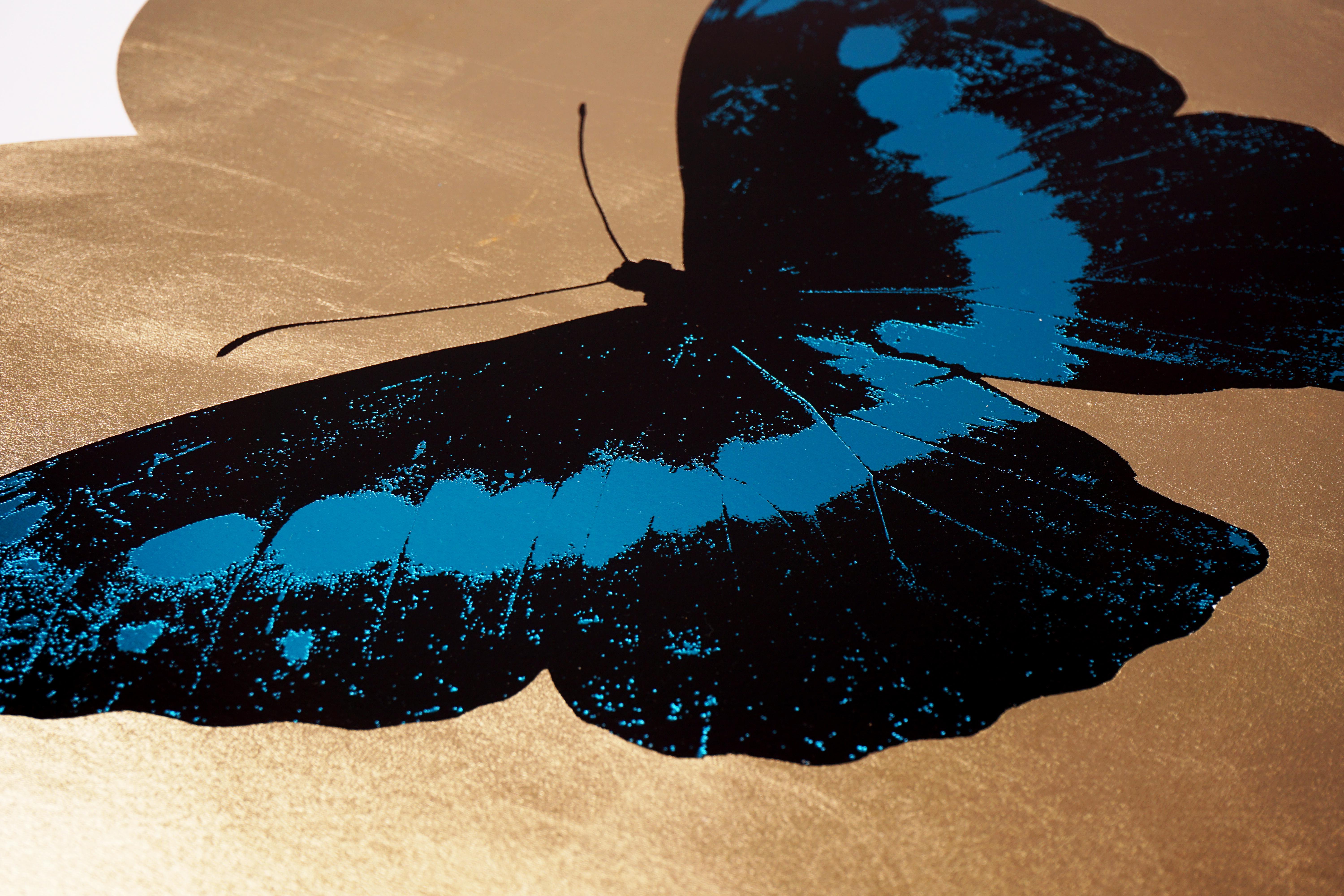 The 'I Love You' Butterfly in Turquoise and Gold is a limited edition silkscreen print by Damien Hirst. This uplifting and pop art work features a foil block iridescent butterfly, surrounded by a gold leaf heart and set on the crisp white background