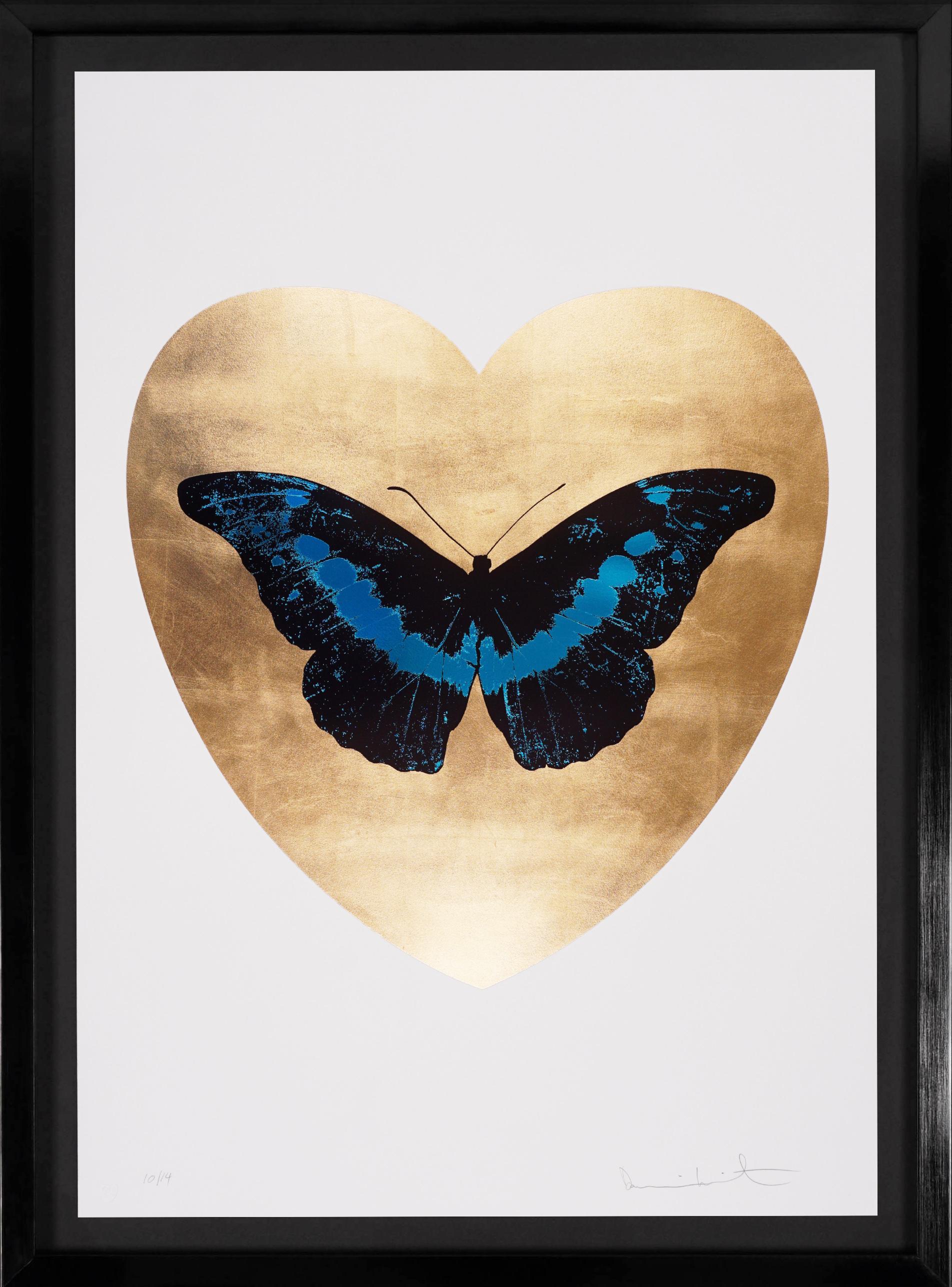 The 'I Love You' Butterfly in Turquoise and Gold is a limited edition silkscreen print by Damien Hirst. This uplifting and pop art work features a foil block iridescent butterfly, surrounded by a gold leaf heart and set on the crisp white background