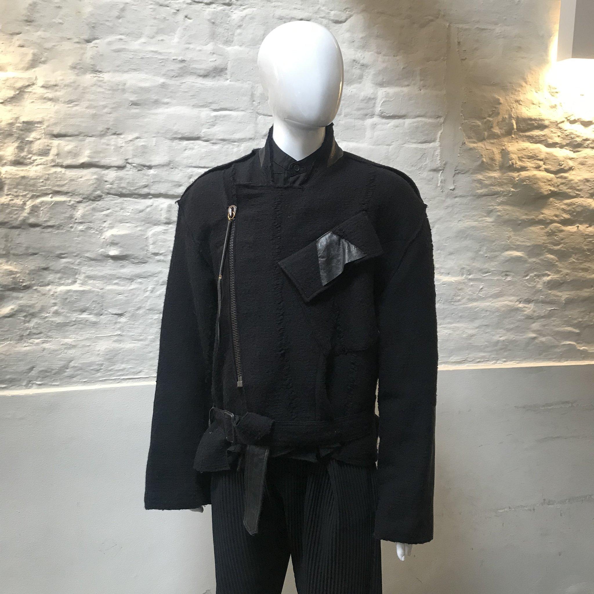 Damir Domas Deconstructed Jacket made in Paris from wool and customised by Benedict Lamb. 

Damir Doma is the founder and creative director of the Damir Doma brand. The Croatian-born designer grew up surrounded by toiles in his mother’s atelier in