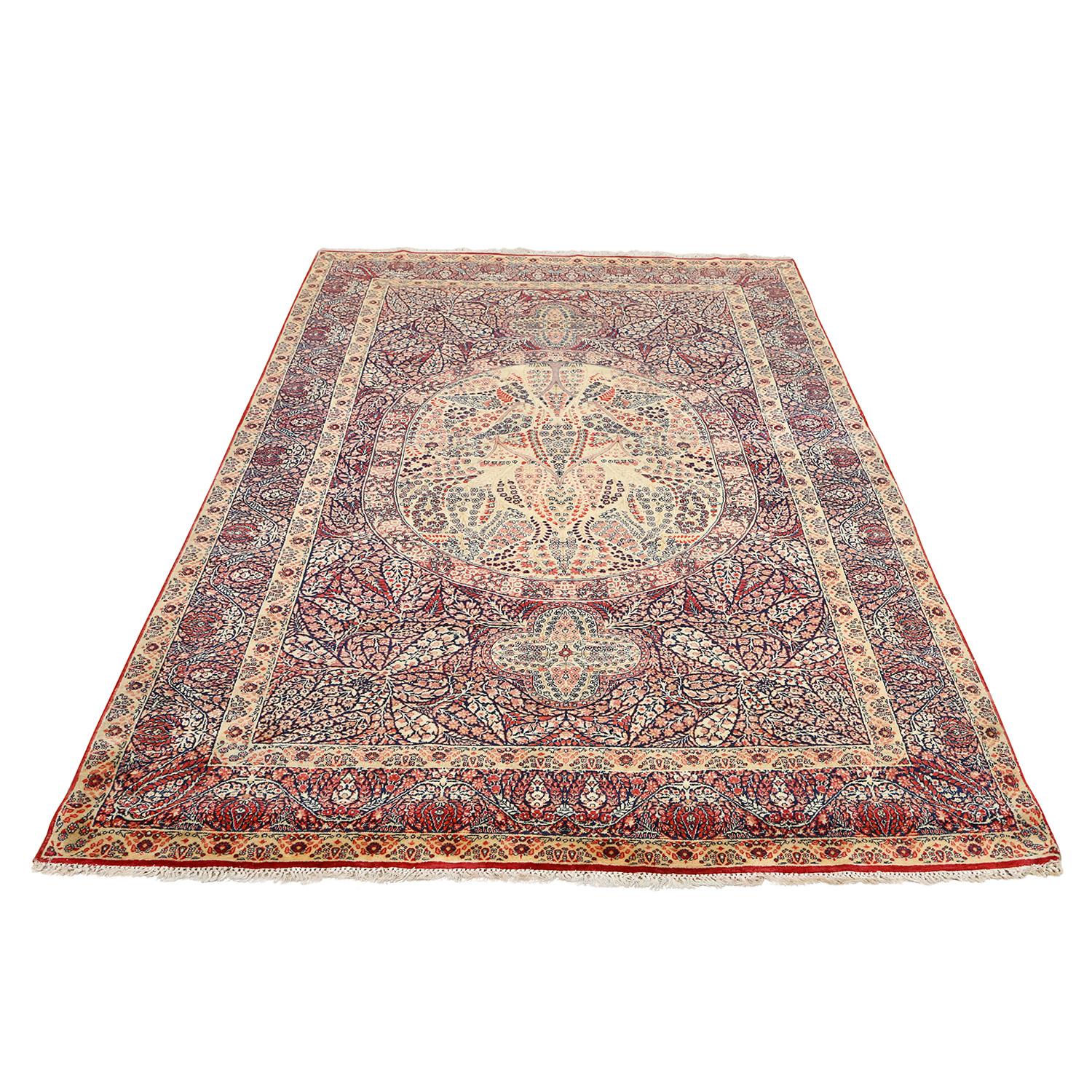This Antique Lavar Rug adorned with a Center Medallion Floral Design is a captivating embodiment of timeless beauty and meticulous craftsmanship. Originating from the celebrated weaving region of Lavar in Persia, these rugs are much more than floor