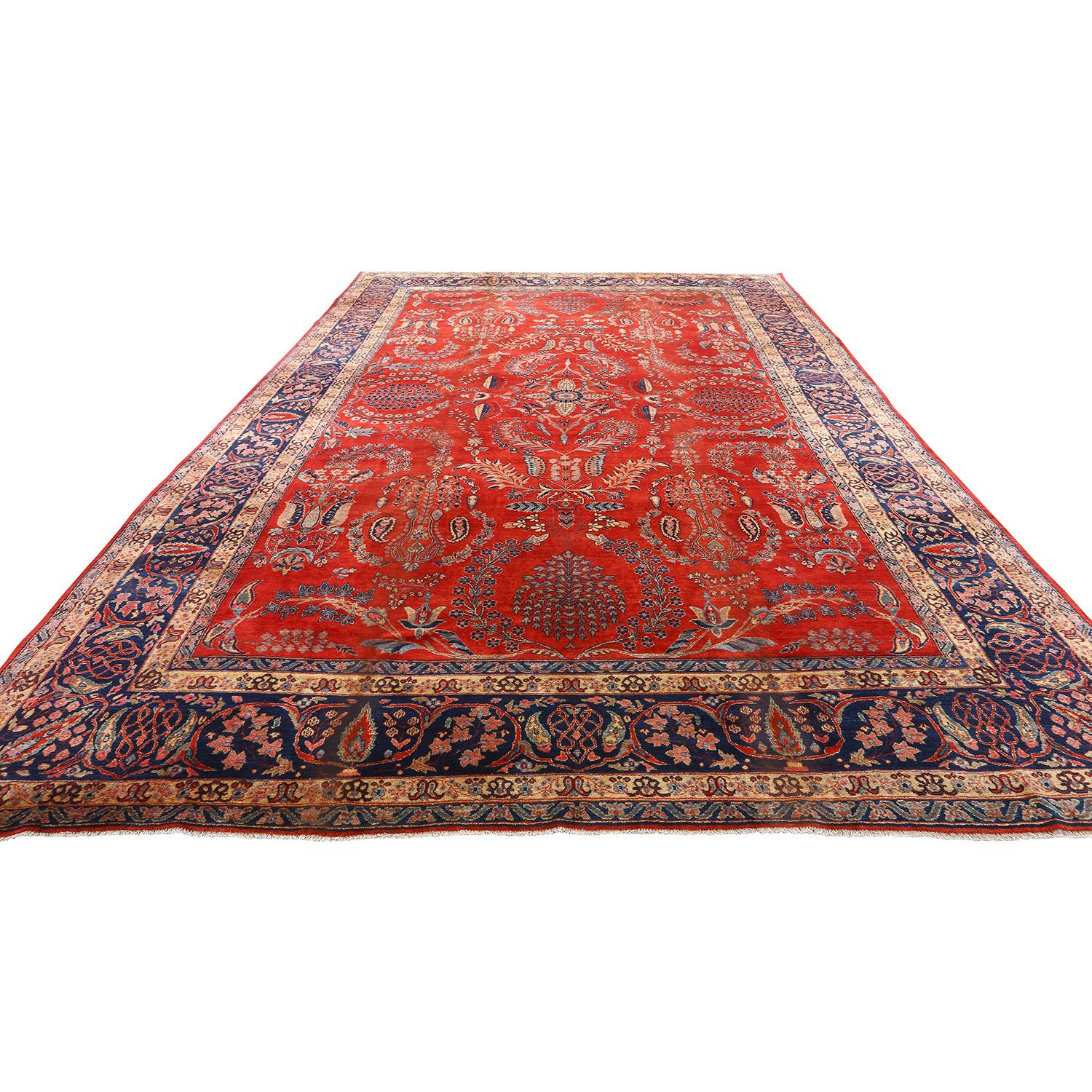 This Antique Sarook Mohajeran Rug, measuring an impressive 14 feet by 10 feet, is a true masterpiece that exemplifies the pinnacle of Persian craftsmanship. With its grand All-Over Design, adorned in rich shades of cherry and navy, it offers a