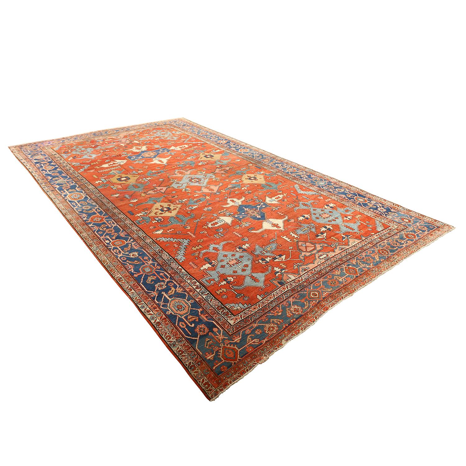 This Antique Serapi Rug is a captivating testament to the artistry and cultural heritage of the Serapi region, nestled in the heart of Persia. These remarkable rugs, often dating back a century or more, are not just floor coverings but cherished