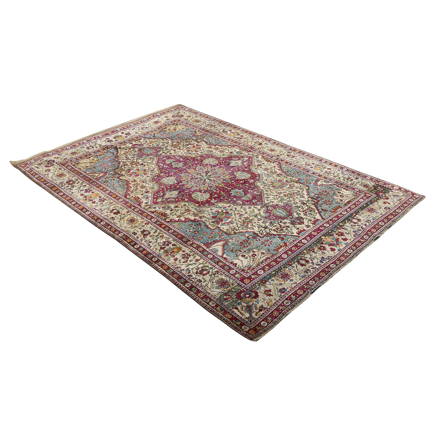 This Antique Kashan Mohtasham Rug is an exquisite masterpiece that combines the artistry of Persian craftsmanship with a captivating color palette. Its Center Medallion Design, adorned with shades of cherry, teal, and creams, weaves together a