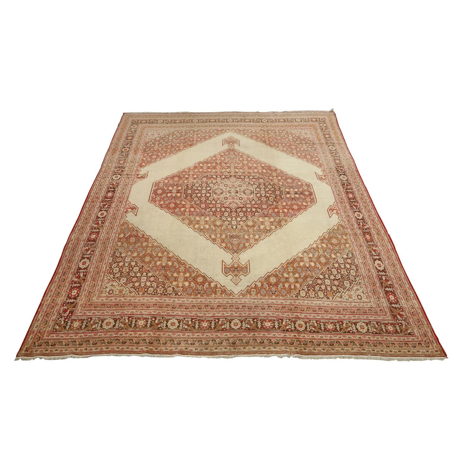 This Antique Tabriz Rug featuring a Center Medallion Design is a captivating testament to the rich tradition of Persian craftsmanship and artistry. Hailing from the esteemed weaving city of Tabriz, these rugs are renowned for their intricate