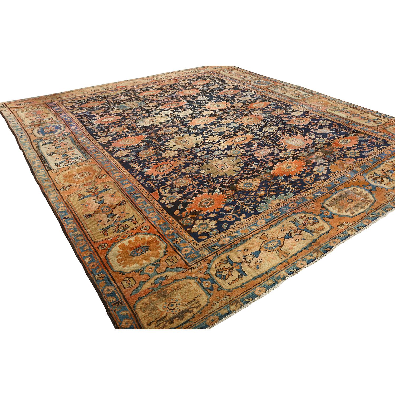 This Antique Ziglar Mahal Rug, sized at a generous 13 feet by 11 feet, is a living testament to the enduring appeal of Persian craftsmanship. Crafted with meticulous care, this rug boasts a woolen composition with a sturdy cotton foundation,
