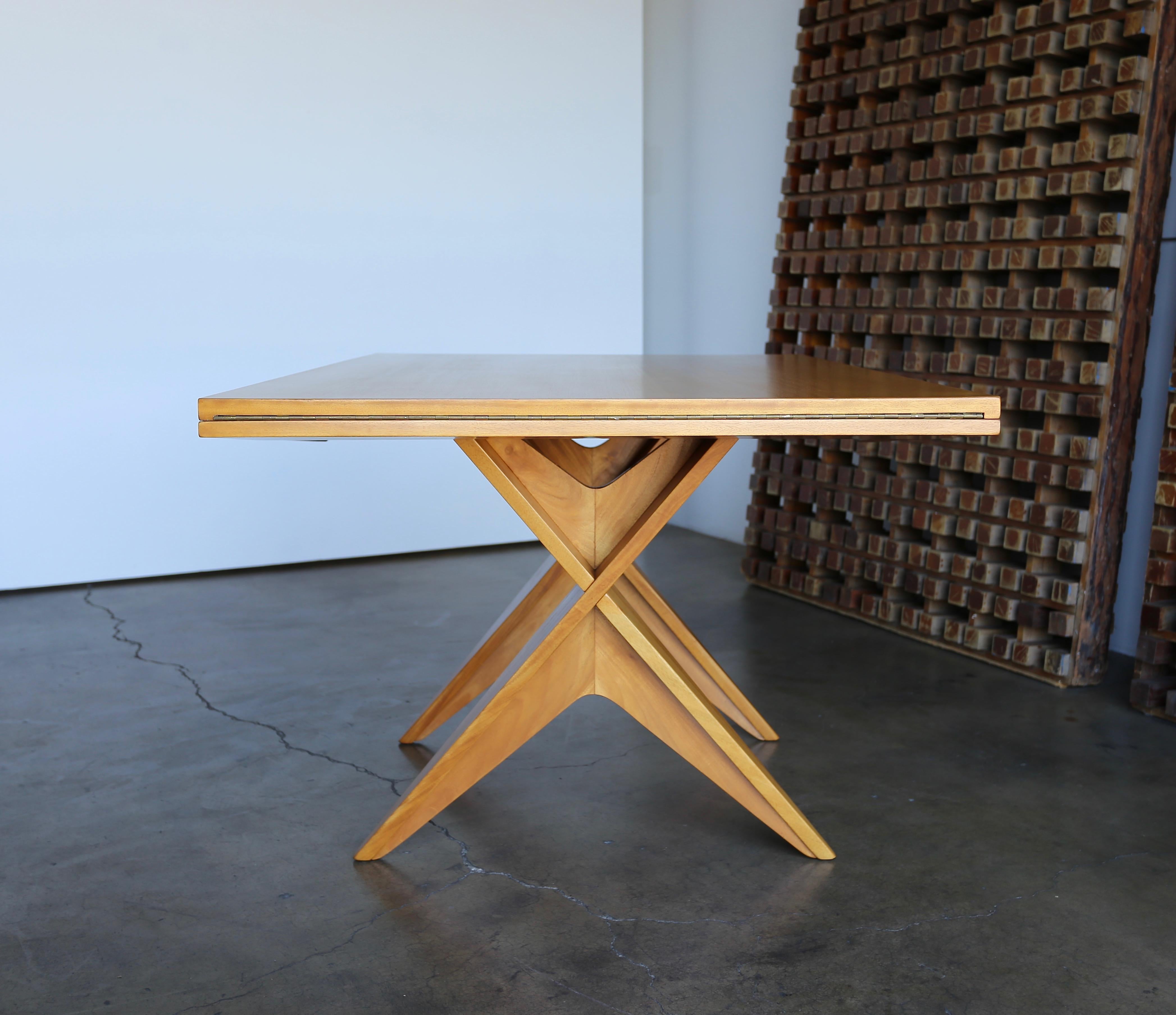 Drop-leaf dining table by Dan Johnson for Hayden Hall Furniture, circa 1947. A beautiful example of California modern design. This piece has been professionally restored.

Measures 82