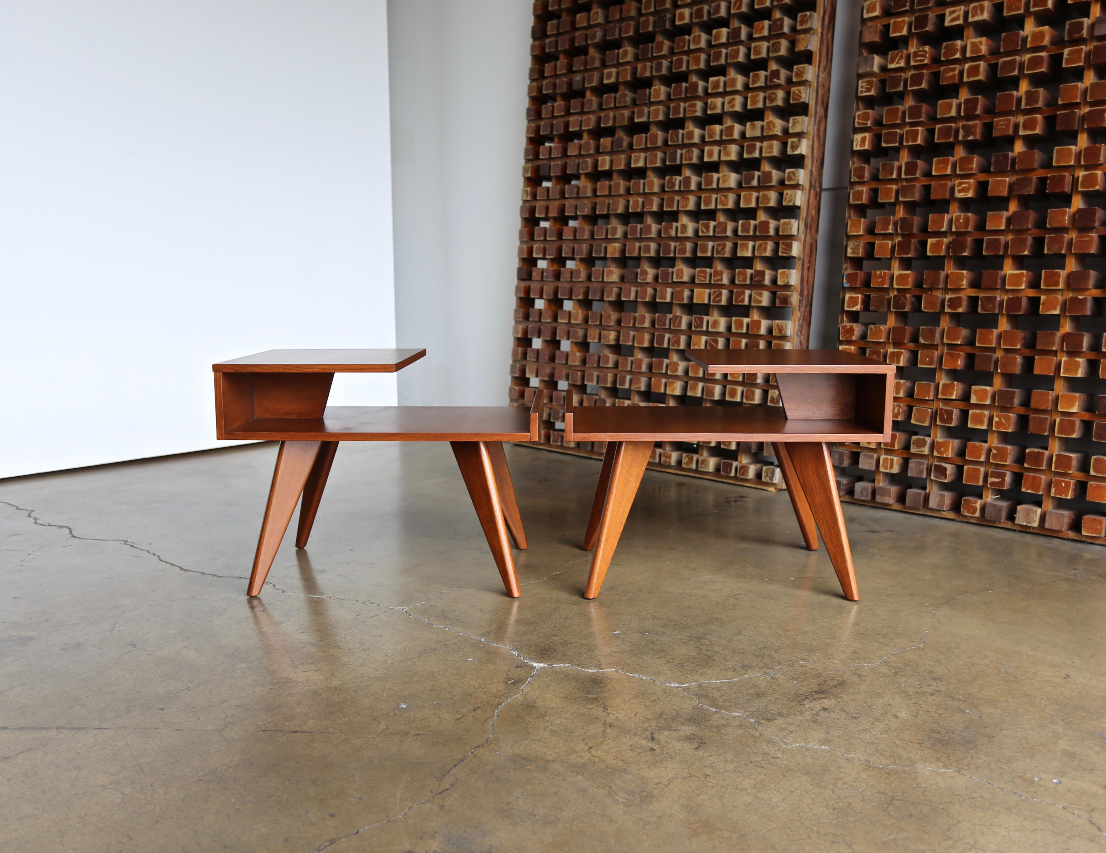 A pair of side tables designed by Dan Johnson for Los Angeles-based Company, Hayden Hall. Original mahogany finish with a nice patina. Only made for one year, 1947. This pair has been professionally restored.
 