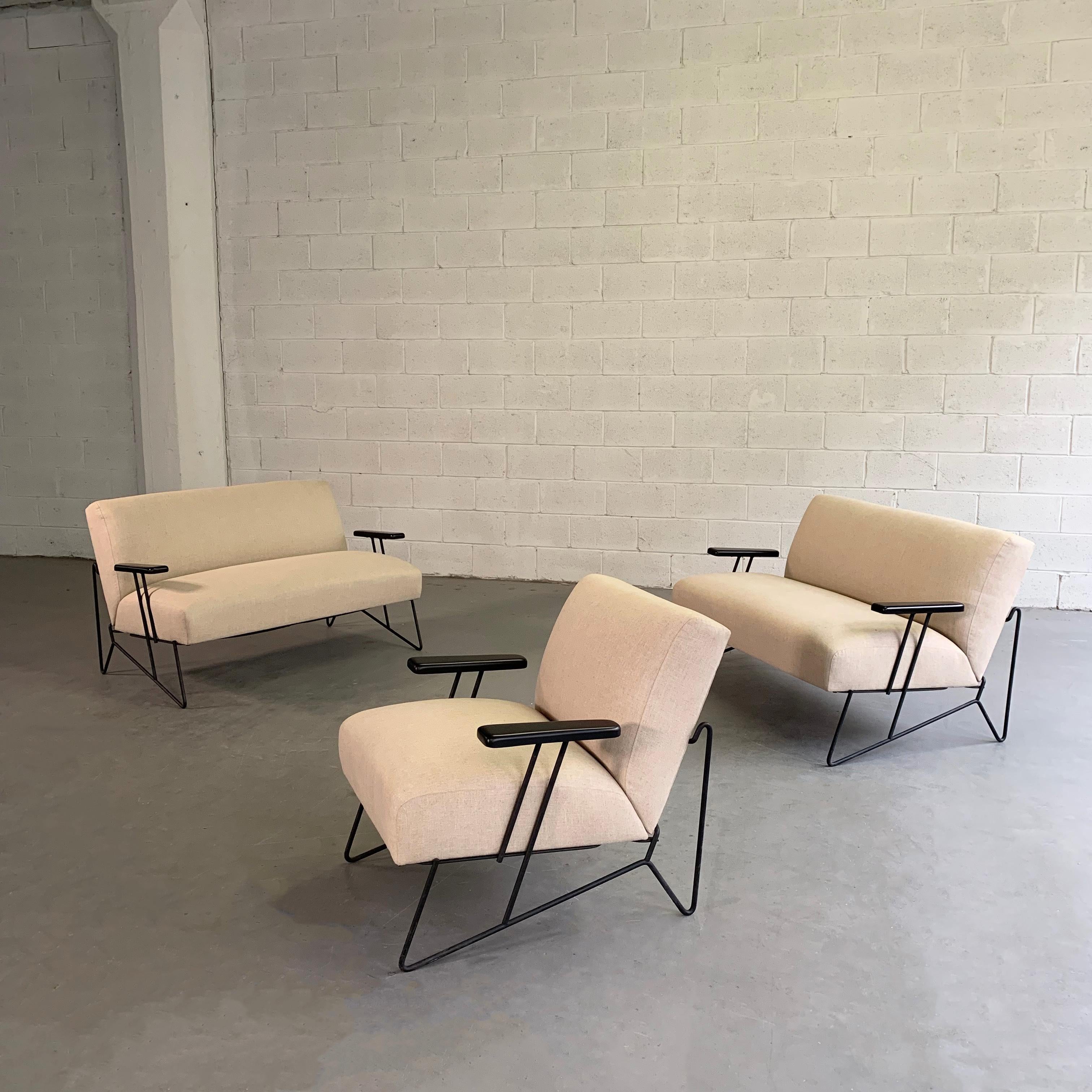Rare set of 2 settees or loveseats with matching lounge chair by Dan Johnson for Pacific Iron features wrought iron frames with lacquered maple armrests and newly upholstered seats and backs in cream cotton linen blend that seem to float within