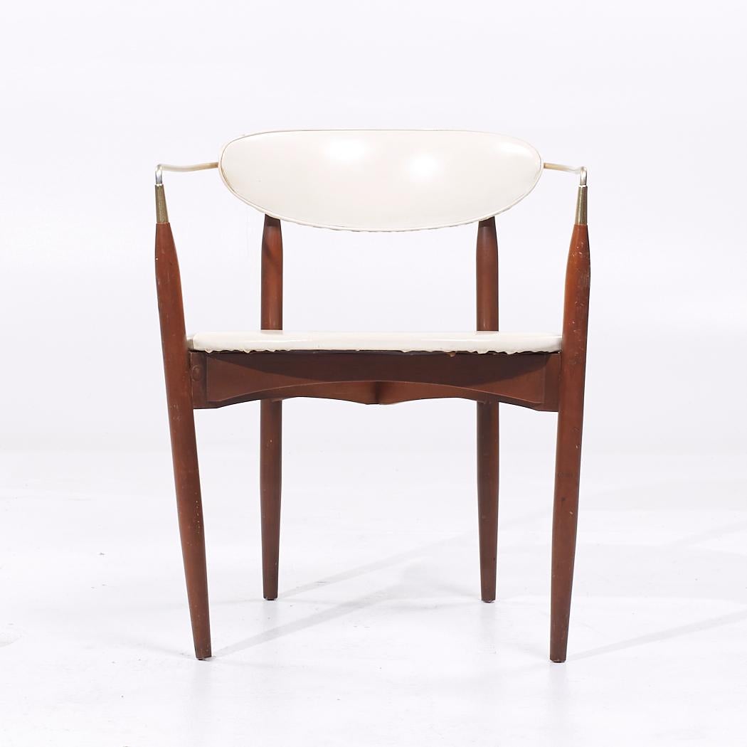 Dan Johnson for Selig Viscount Mid Century Brass and Walnut Chair

This chair measures: 22.75 wide x 21 deep x 28 high, with a seat height of 17.5 and arm height/chair clearance 26.25 inches

All pieces of furniture can be had in what we call