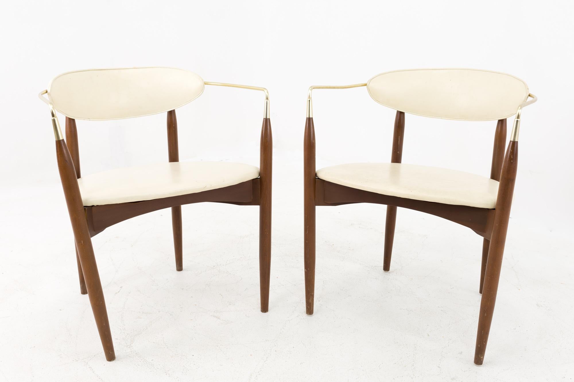 Dan Johnson for Selig Viscount midcentury walnut and brass dining chairs - pair.
Each chair measures 23 wide x 21 deep x 28 inches high.

All pieces of furniture can be had in what we call restored vintage condition. This means the piece is