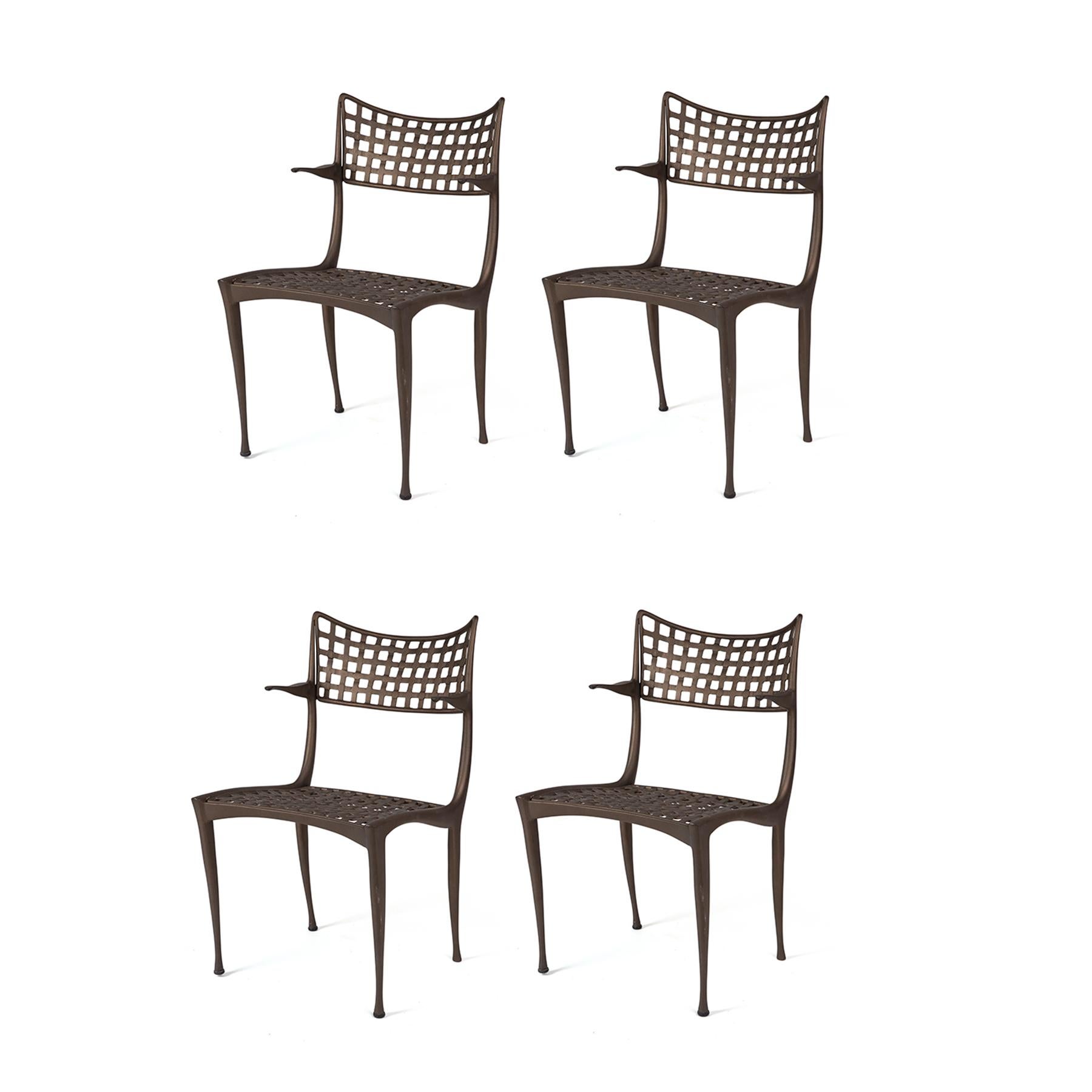 Suitable for indoor and outdoor use, these four wonderfully organic Sol Y Luna lounge chairs by Dan Johnson (an adaptation of Johnson's 1954 Gazelle Collection) feature a metal pattern that mimics woven caning. Price listed is for the 4 chairs.