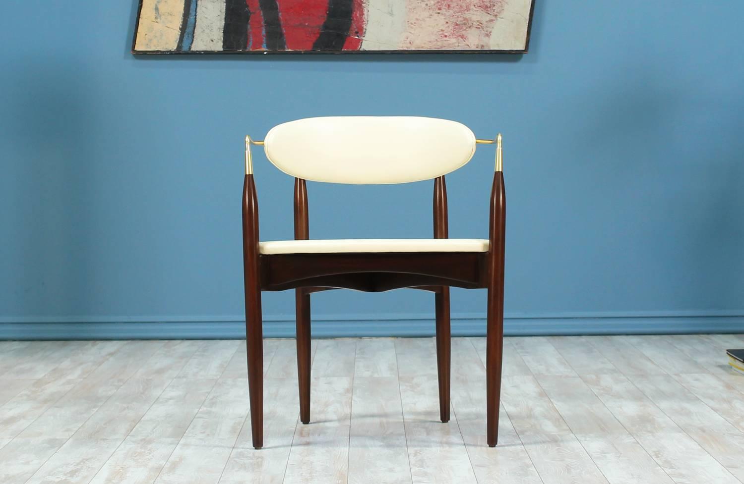 Mid Century Modern “Viscount” armchair designed by Dan Johnson for Selig in the United States circa 1950’s. This elegant design features a newly refinished walnut wood frame and freshly polished tubular brass arms. The upholstery is new full grain