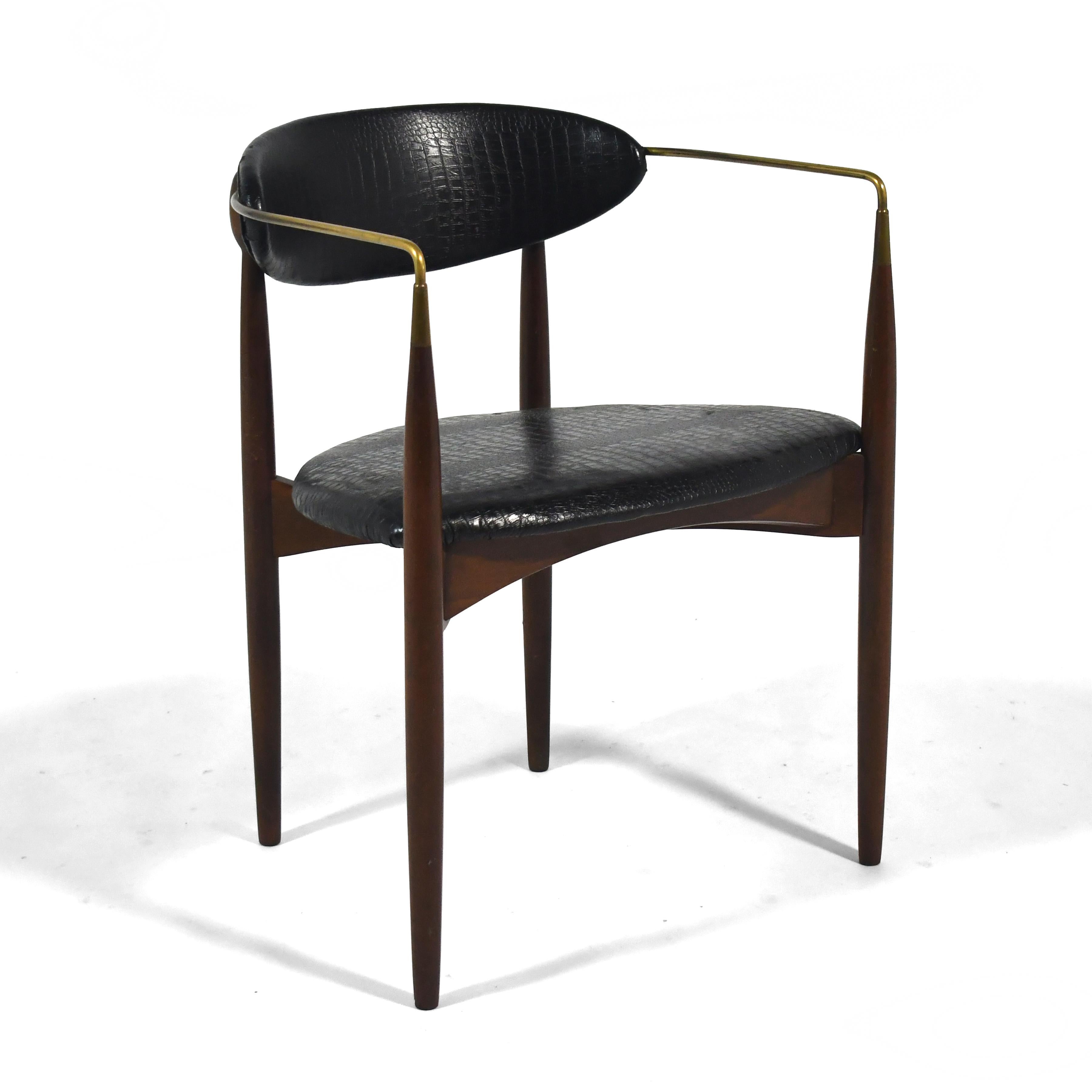 Often incorrectly attributed to Danish designer Ib Kofod-Larsen, these elegant chairs are an early design by American architect Dan Johnson. They were produced and distributed by Selig in the US. Like his famous Gazelle chair, this design is light,