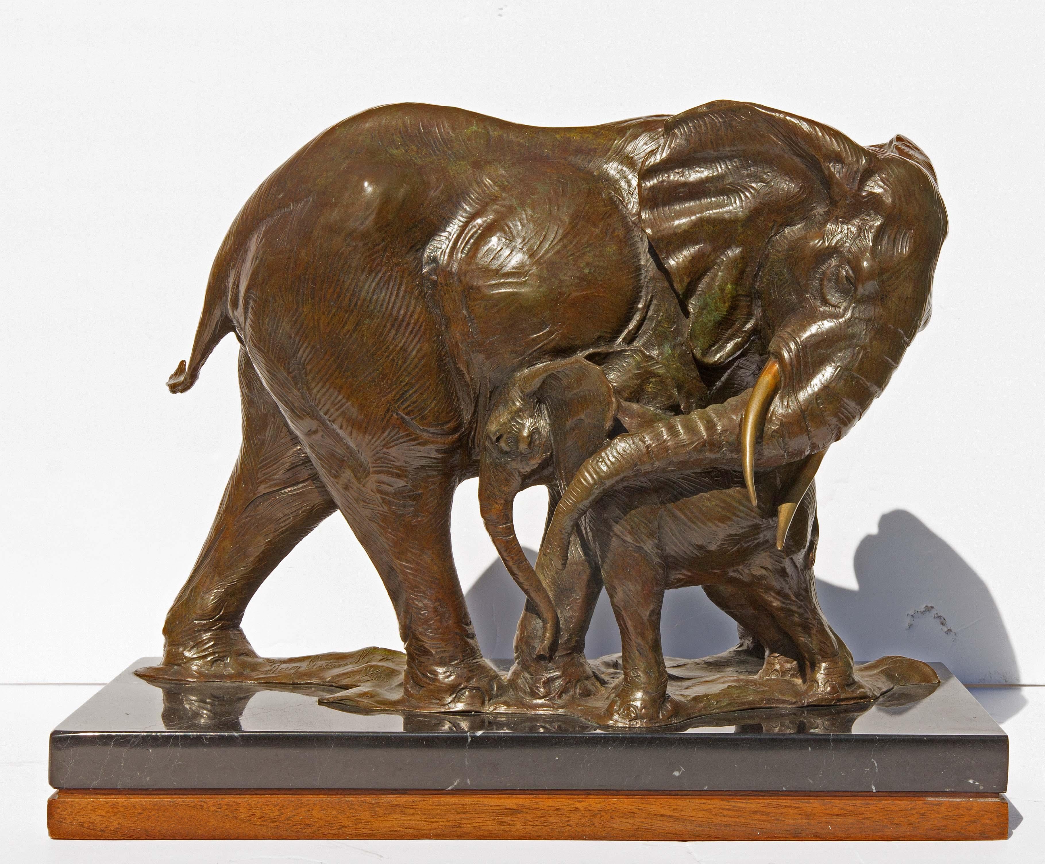 Poignant bronze sculpture of nurturing mother elephant and her calf. Rich brown patina with hints of verdigris. By American sculptor Dan Ostermiller. Signed and dated 1992. Casting number 14 out of 30. Mounted on marble and wood base.
One of