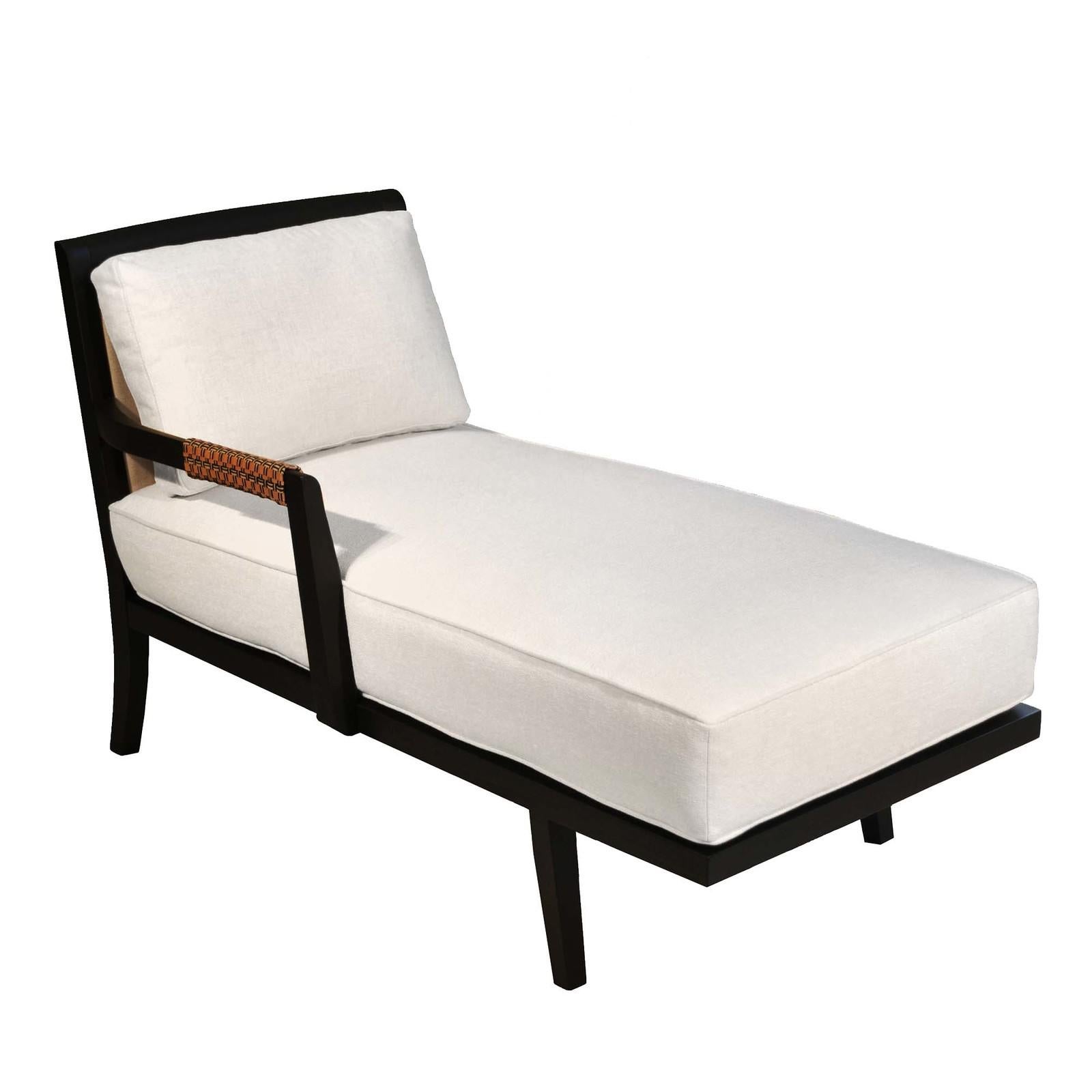 A modern take on the Classic dormeuse, this plush chaise lounge will create a stylish welcoming spot to relax in a living or bedroom. Featuring a single arm embellished with a woven leather and linen, the solid ash frame has a dark finish that