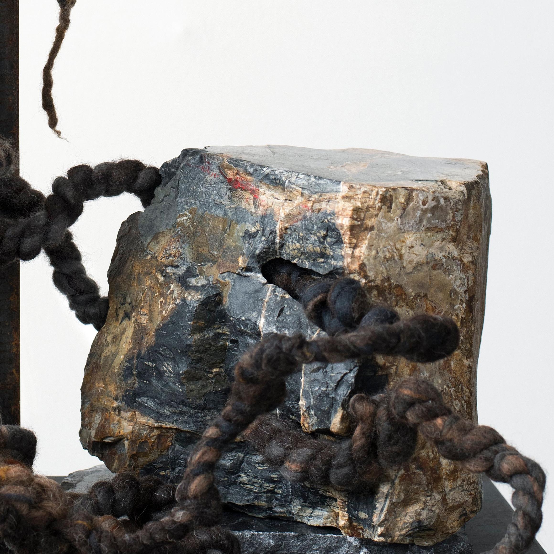 The piece combines a Picasso marble chunk and a weathered steel angle with exotic fibers knotted, twisted and entangled into a small ‘Cling' sculpture. The base is blackened steel.
