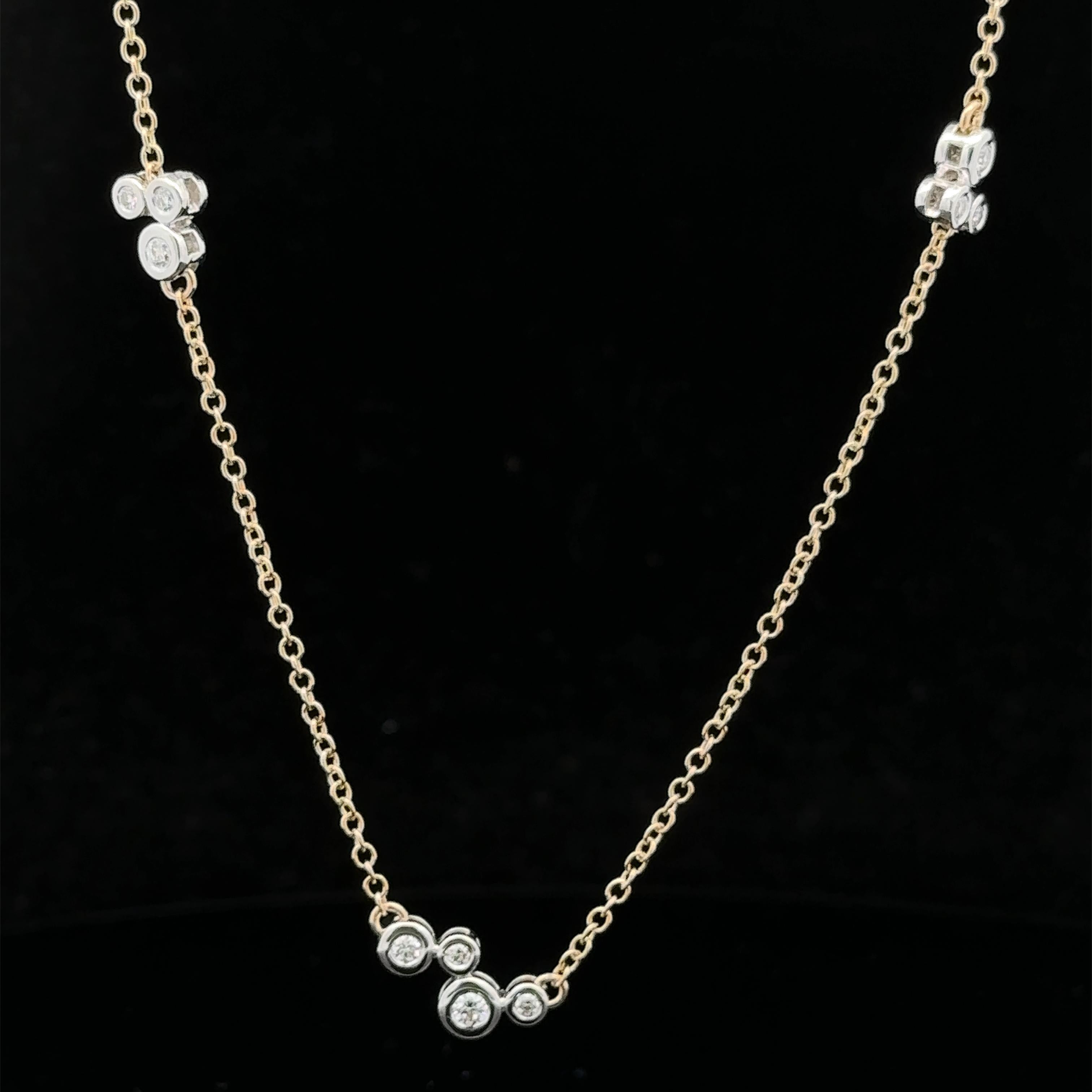 --Stone(s):-- 
(14) Natural Genuine Diamonds - Round Brilliant Cut - Bezel Set - F/G Color - VS1/VS2 Clarity - 0.30ctw (approx.)

Material: Solid 18k Yellow & White Gold 
Weight: 5.74 Grams
Chain Type: Diamond Cluster Stations w/ Cable Links
Chain