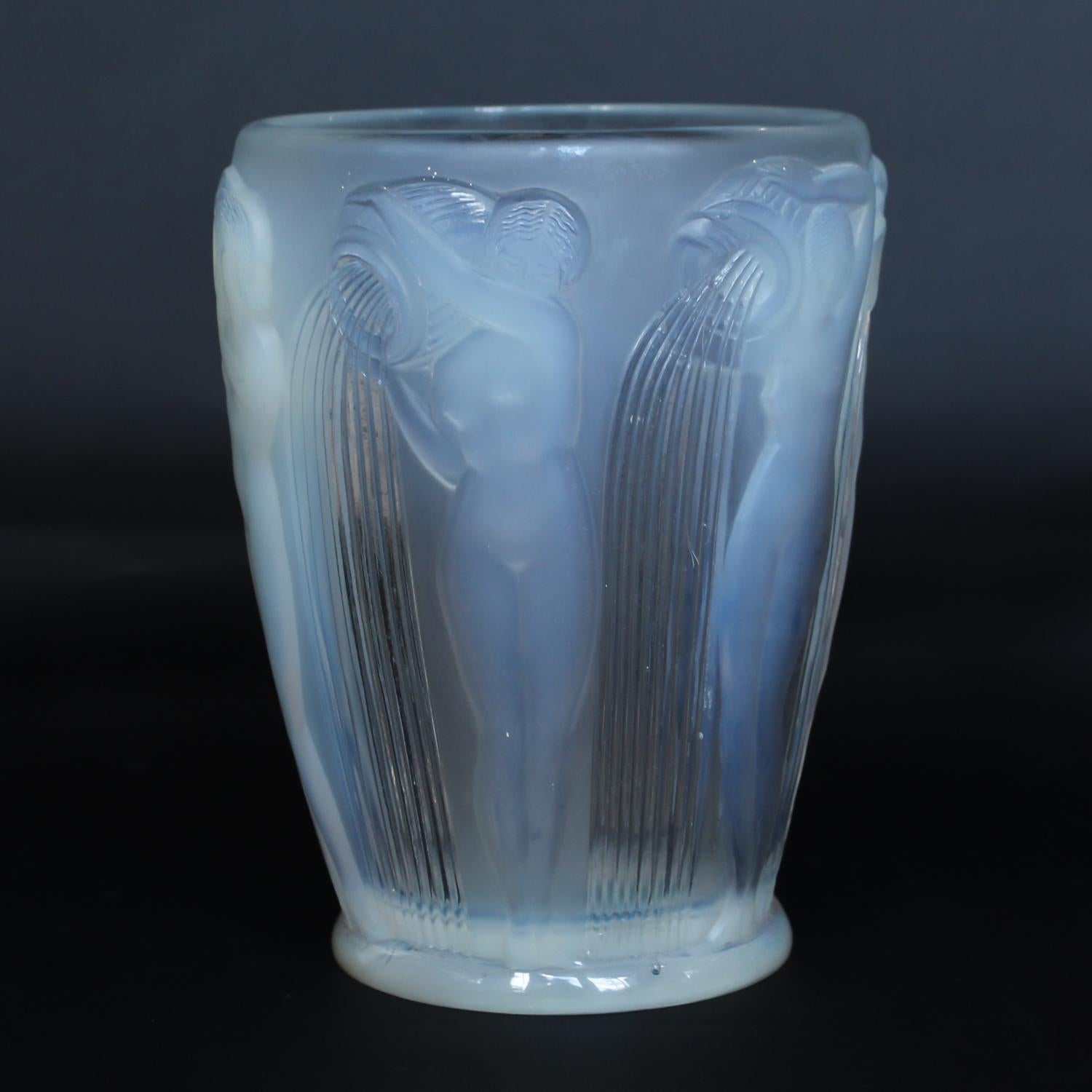 'Danaides', an Art Deco frosted, opalescent glass vase by René Lalique (1860-1945). Decorated over with raised figures of daughters of King Danaus of Argos.

Re-polished base.

Stencil etched R Lalique France to base

Marcilhac, R Lalique Catalogue