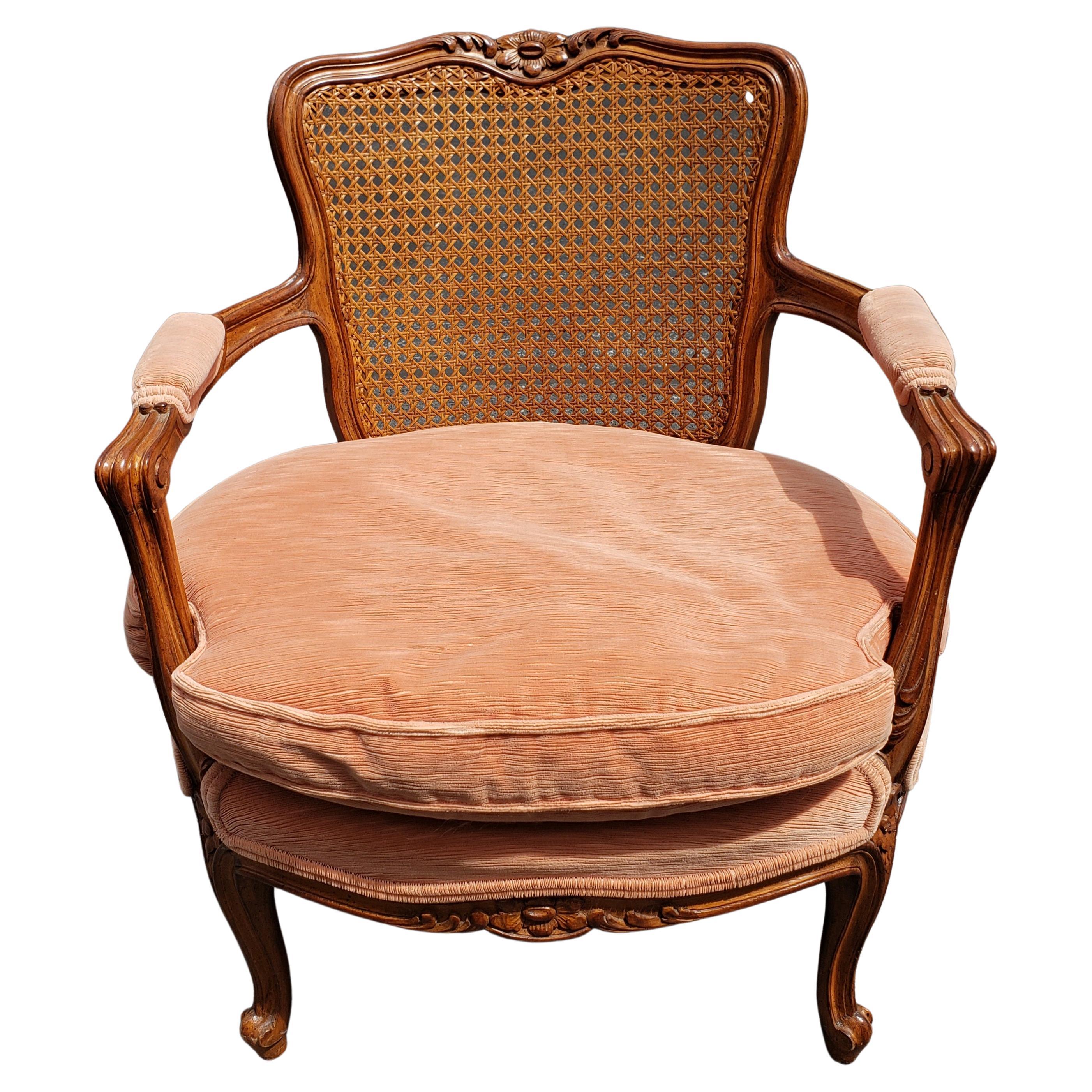 Absolutely gorgeous Danby Furniture French Bergère chair with cane back. Carved walnut wood. 
Very comfortable body made 50% cotton felt, and 50% of horse hair and hogs hair. Very soft cushion made out of 25% dawn and 75% duck feathers, low height.