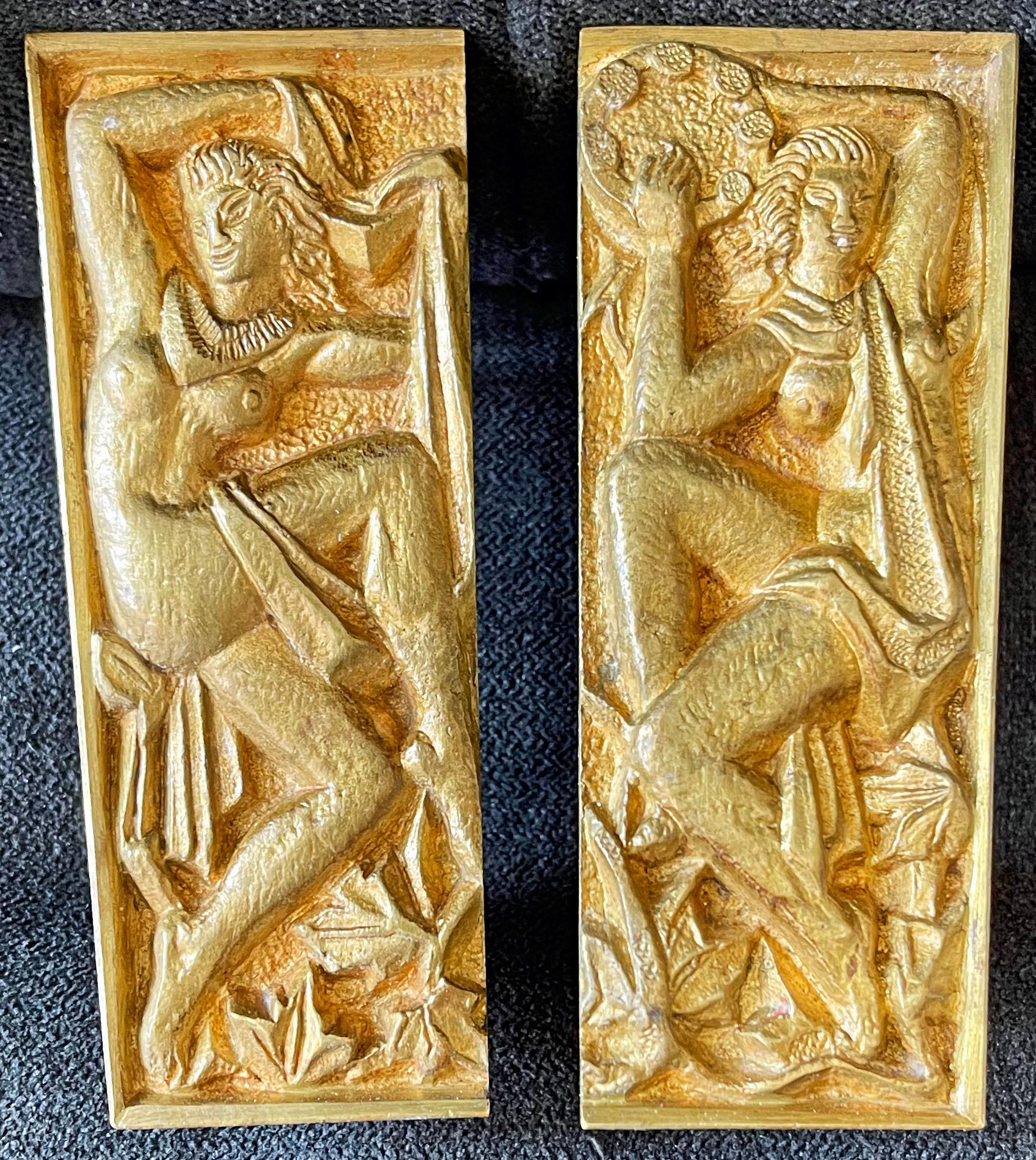 Fabulous and rare, this pair of gilded bronze door pulls depict two joyous nude female figures, one a dancer and the other playing the tambourine. Although the sculptor is not known, these represent the best of high-style Art Deco in 1920s France.