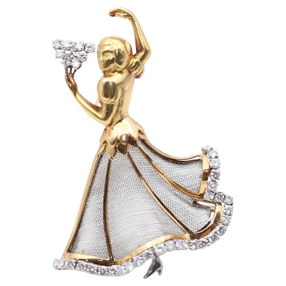 Diamonds 18K Yellow Gold Flamenco Dancer Brooch. Created in 1940. 

This fine and impressive vintage diamond brooch has been crafted in 18 Karats Yellow and White Gold. The brooch has been modeled in the form of a posing flamenco dancer. The arms