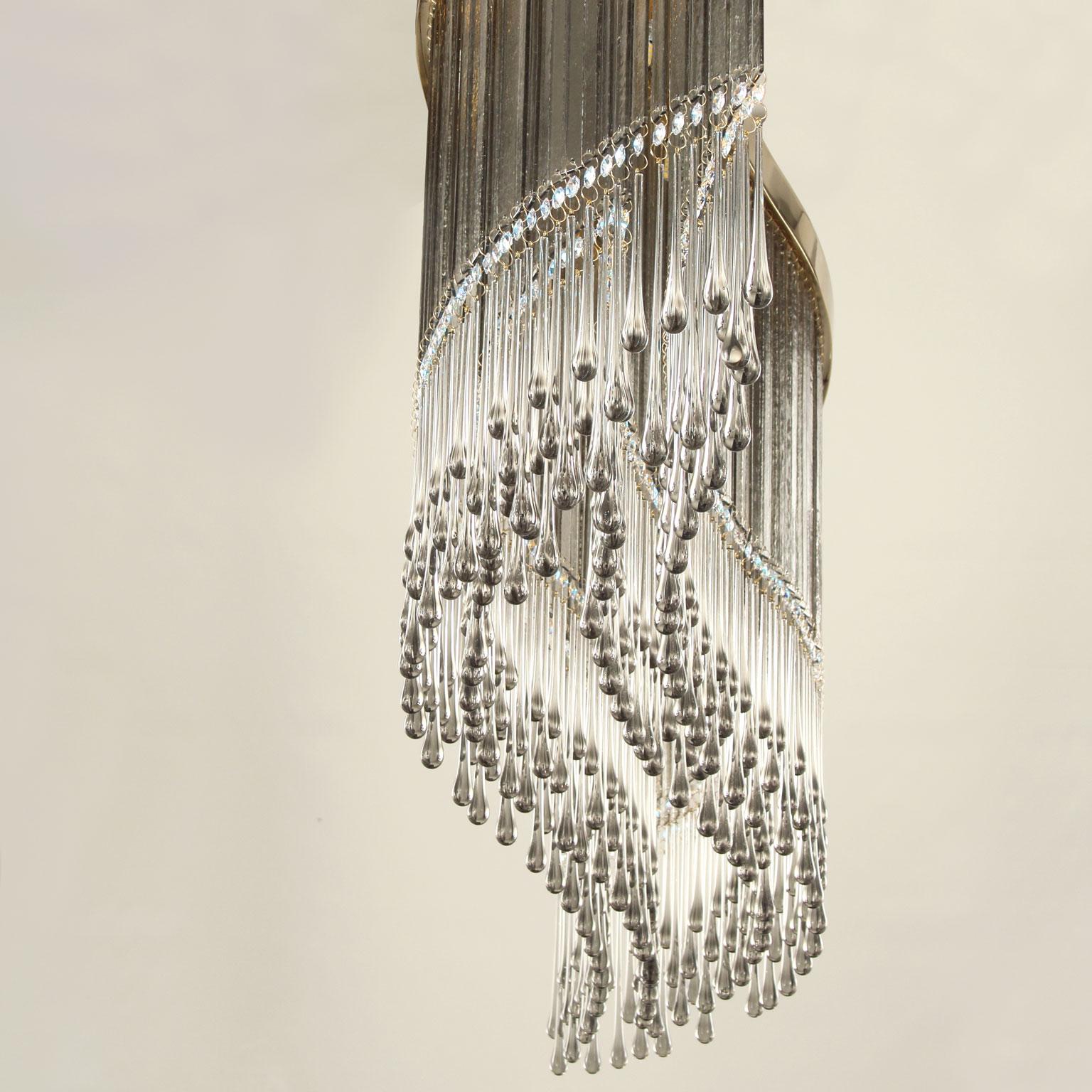 Dancer suspension lamp with grey Murano glass and Swarovski elements by Multiforme.

The Dancer design lamp is our interpretation of the traditional crystal and glass chandeliers. The whole structure of this suspension lamp is composed of a cascade