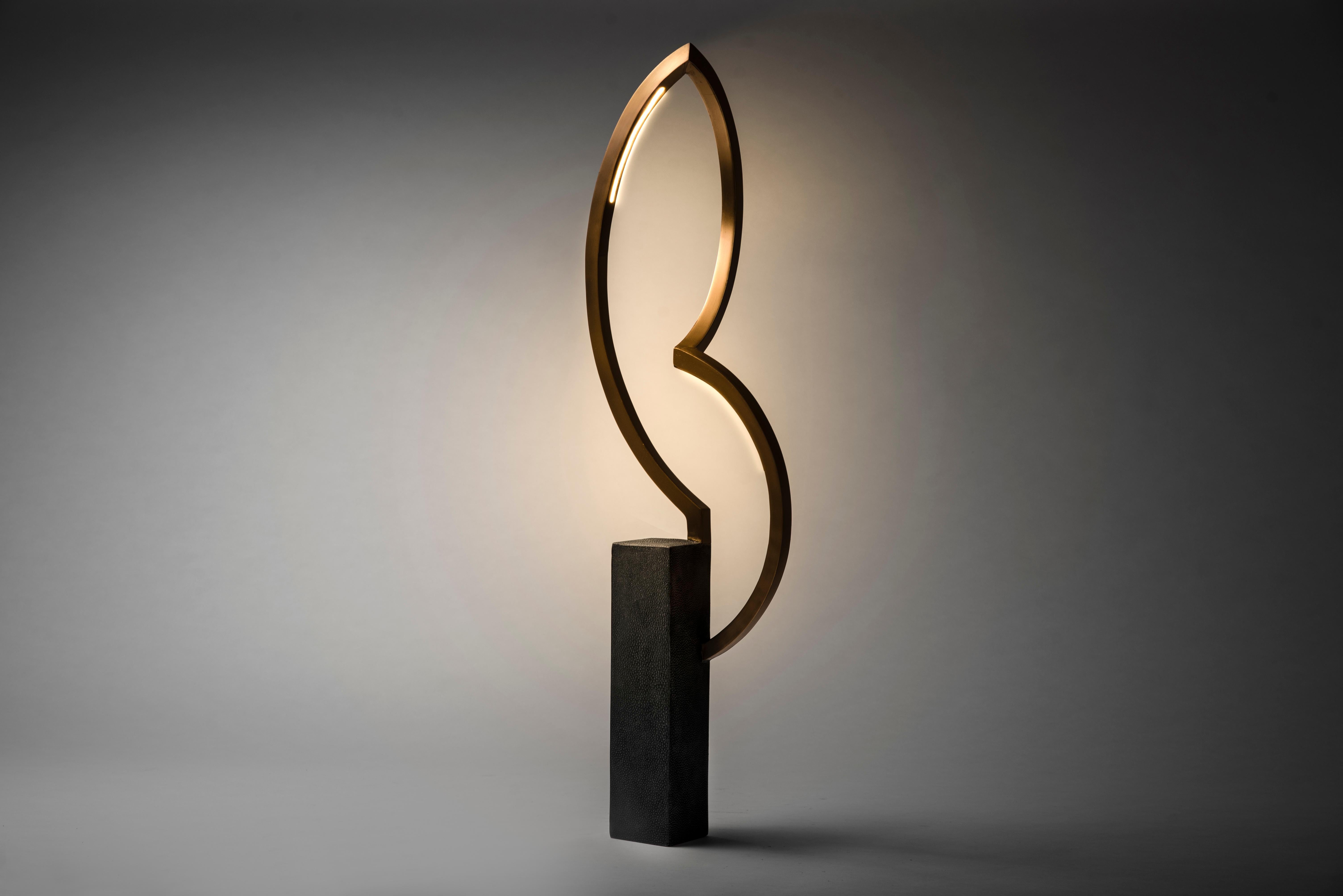 Patrick Coard Paris launches a unique and beautifully sculptural lighting collection inspired by music as a continuation of his candle line. The dancer lamp small in bronze-patina brass and Shagreen is an ethereal table lamp with discreet LED lights