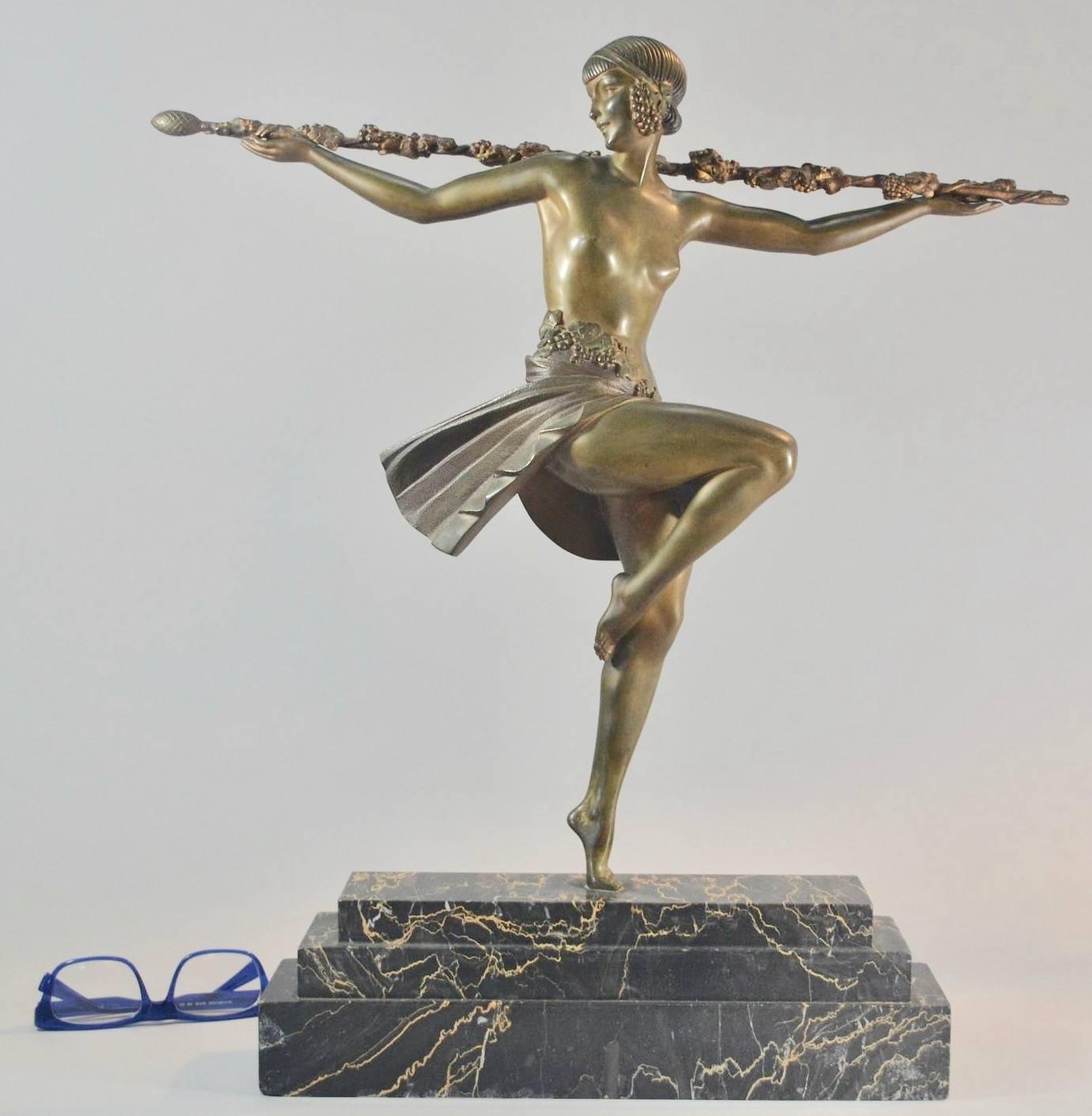 A grand Art Deco statue of a dancer with a Thyrsus by the prolific sculptor Pierre Le Faguays produced in the Etling Foundry in 1930. At 55cm (22 inches) tall this l is a stunning work in every way. A cold painted bronze on a Portoro marble base and