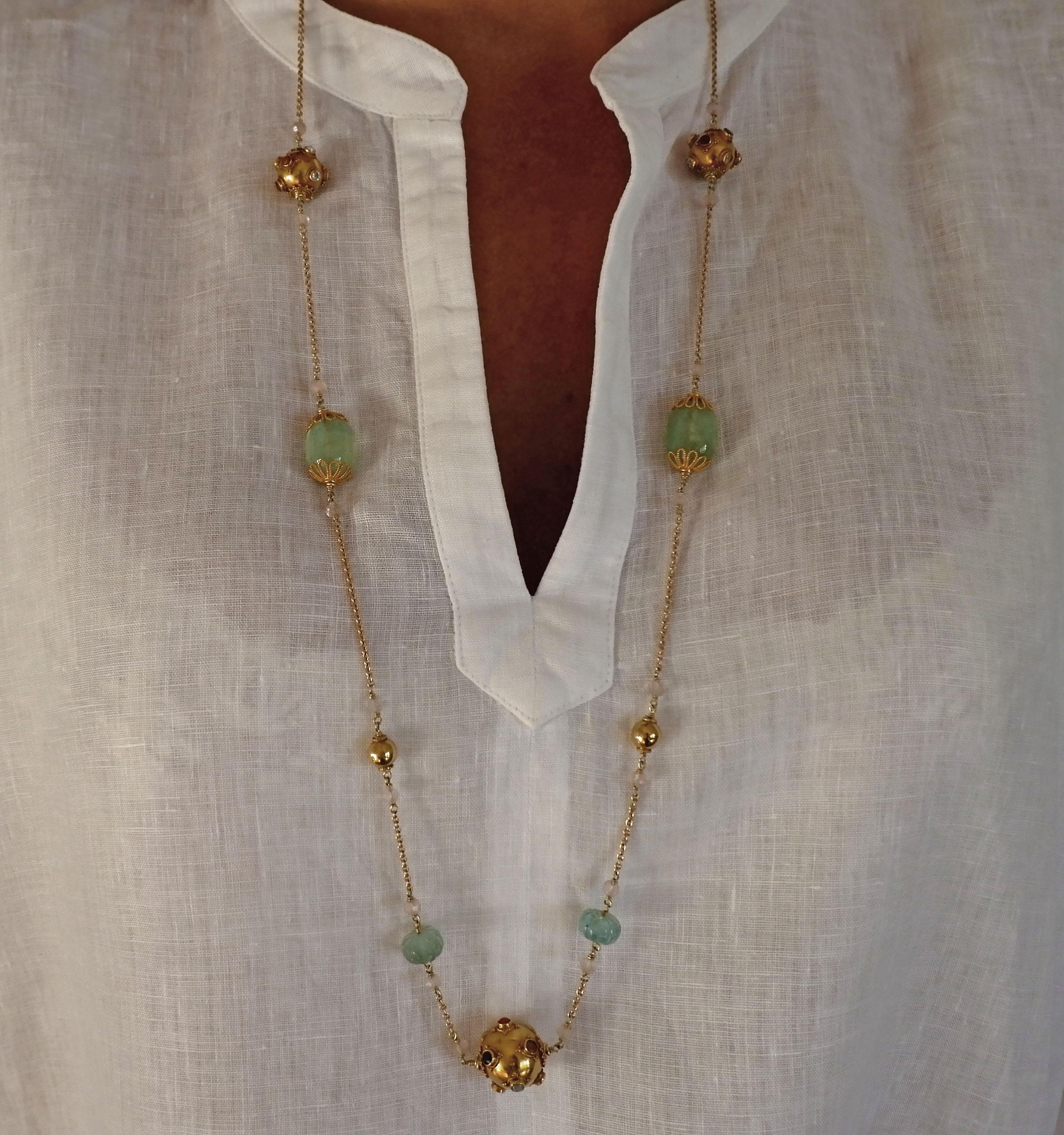 A unique and precious Sautoir Necklace inspired by the ancient silk trade routes. Hand crafted 18 karat gold Indian beads are set with an array of precious stones such as, corals, pearls, emeralds, rubies, diamonds, sapphires, citrines and