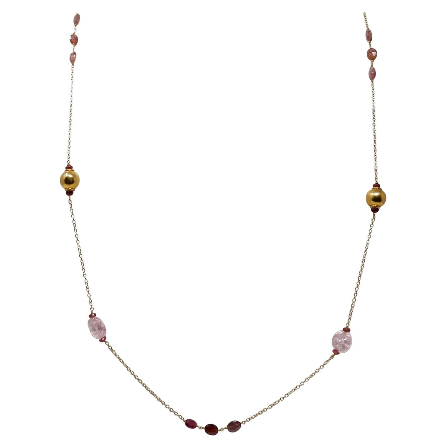 An elegant 18 karat gold, hand crafted gold necklace with tumbled light pink Morganite and faceted oval rubellite beads. The gold beads have been hand crafted in India. Morganite belongs to the sought after beryl family of gems which also includes