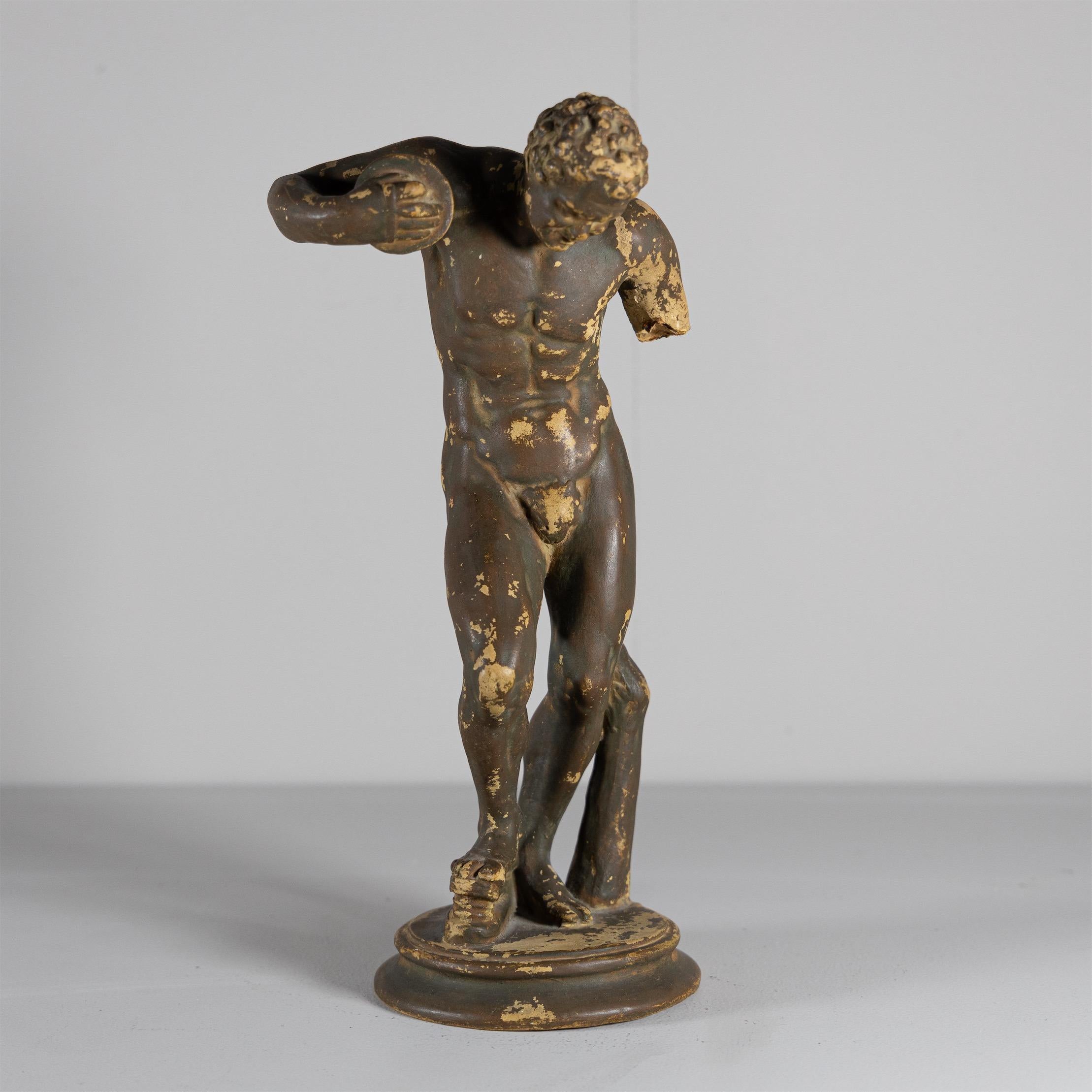 Small ceramic statue of the Dancing Faun after the original by Massimiliano Soldani-Benzi from 1695/1697.