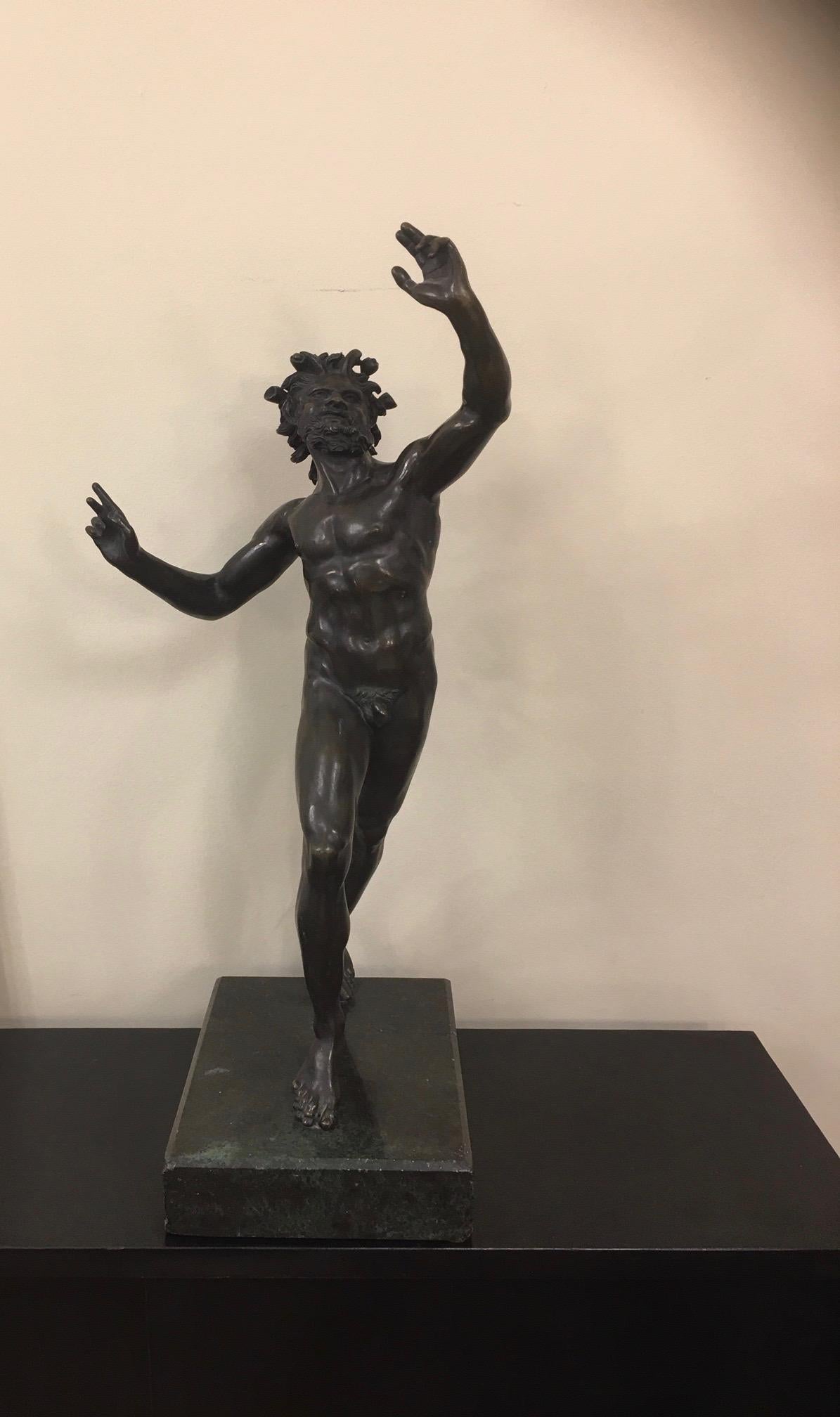 Dancing faun of Pompei, in Bronze, object of the grand tour. Large bronze sculpture after the dancing faun of Pompei. Brown patina of dark gray green; on rectangular marble plinth. Patinated bronze figure of the famous dancing fauna, discovered in