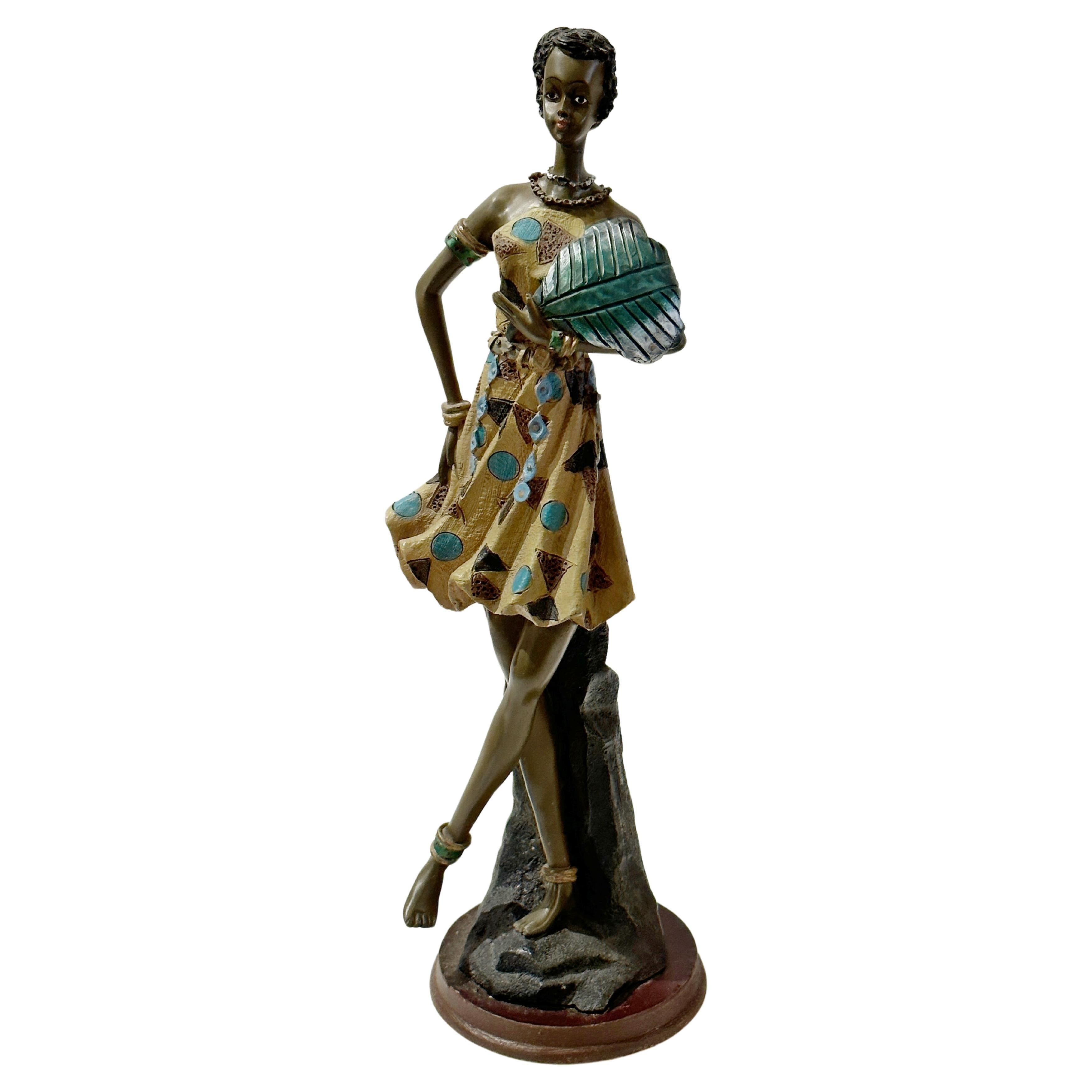 "Dancing in the Heat" African Figurine Sculpture Posing With Her Large Leaf Fan  For Sale