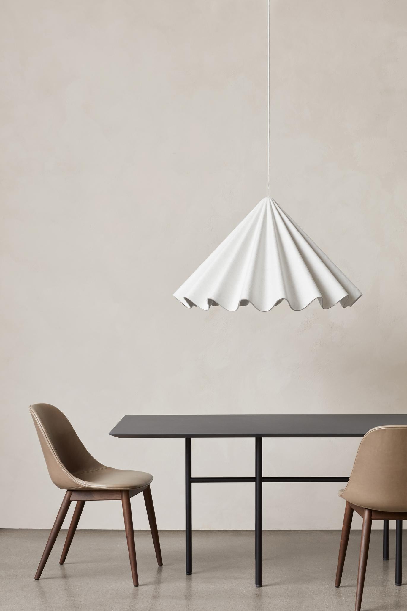 Design is an art of storytelling according to the Copenhagen-based duo Iskos-Berlin, and their Dancing Pendant for Audo Copenhagen puts that principle into practice. Exquisite, yet with a playful twist, the expressive statement lamp takes its design