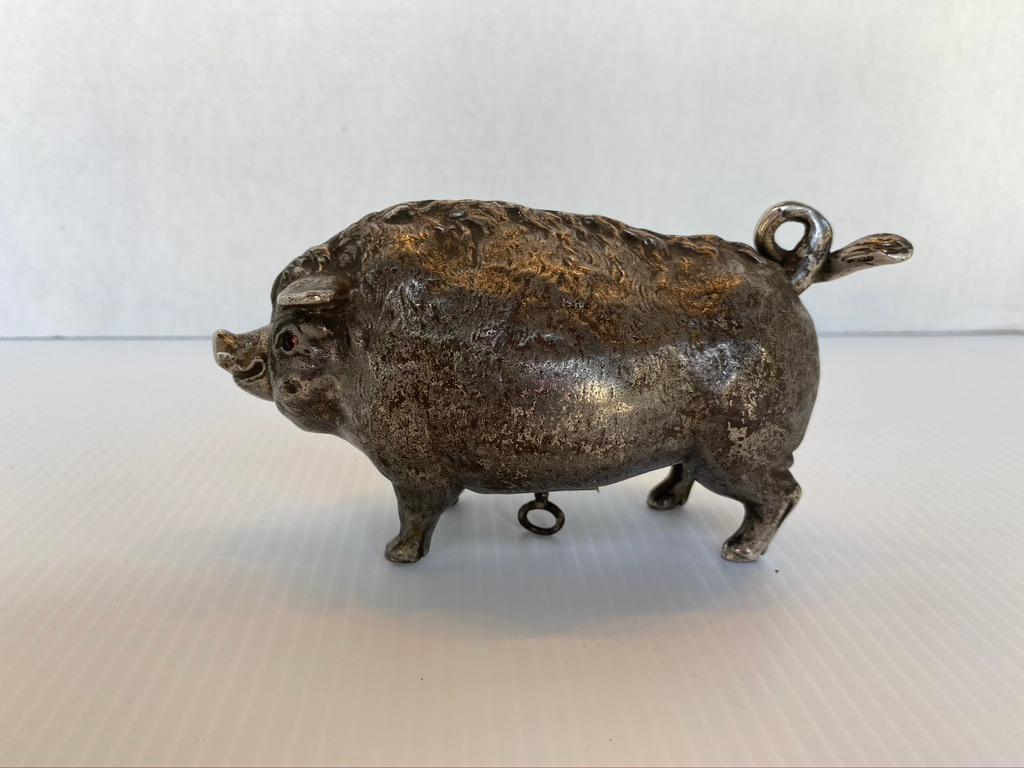 German dancing pig clockwork timer
Late 19th century silvered iron with jeweled eyes.
From the estate of B.F. Edwards Collection
Yes, it still works.