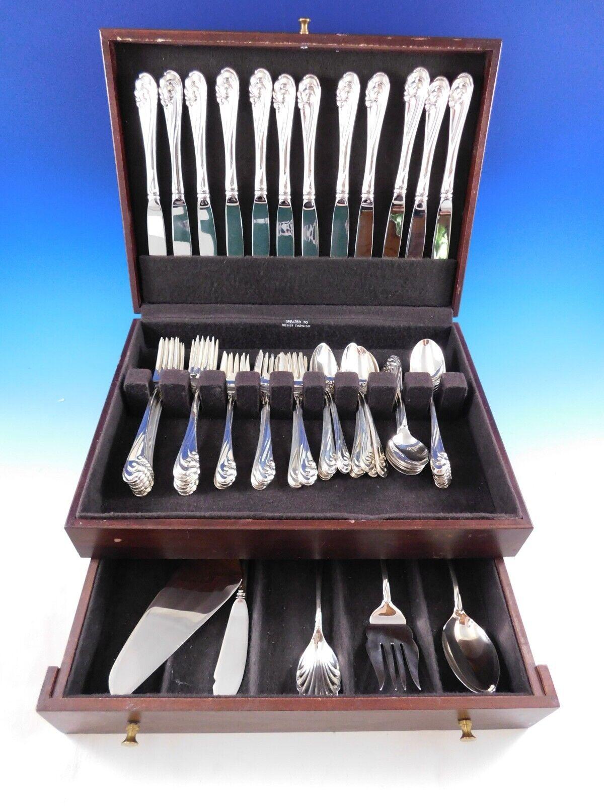 Dancing Surf by Kirk sterling silver Flatware set, 65 pieces. This set includes:

12 Knives, 9