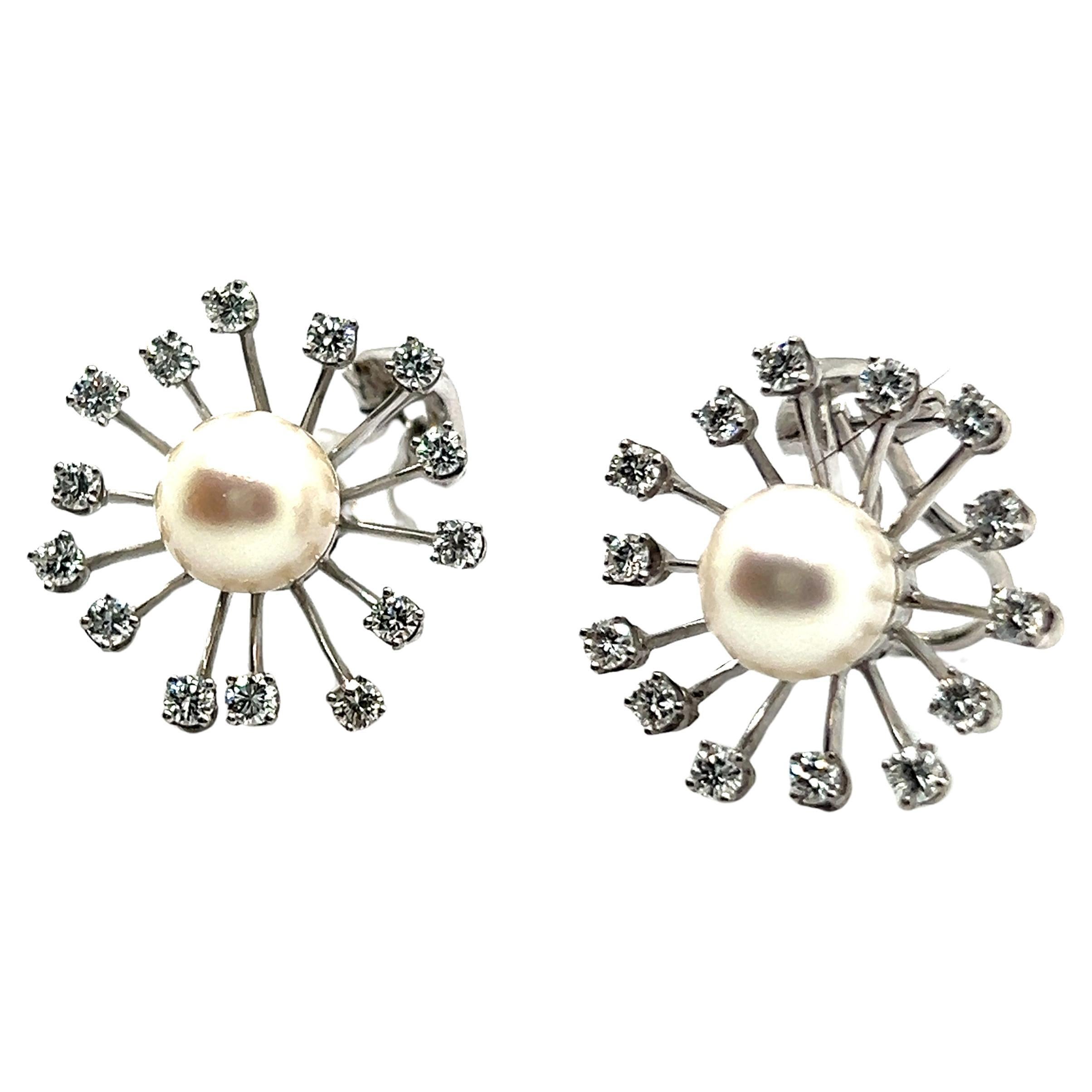 Experience enchantment with our exquisite 18 Karat white gold earrings, inspired by delicate dandelions. At the heart of each earring lies a lustrous cultured Akoya pearl, encircled by a radiant halo of 28 brilliant cut diamonds. This captivating