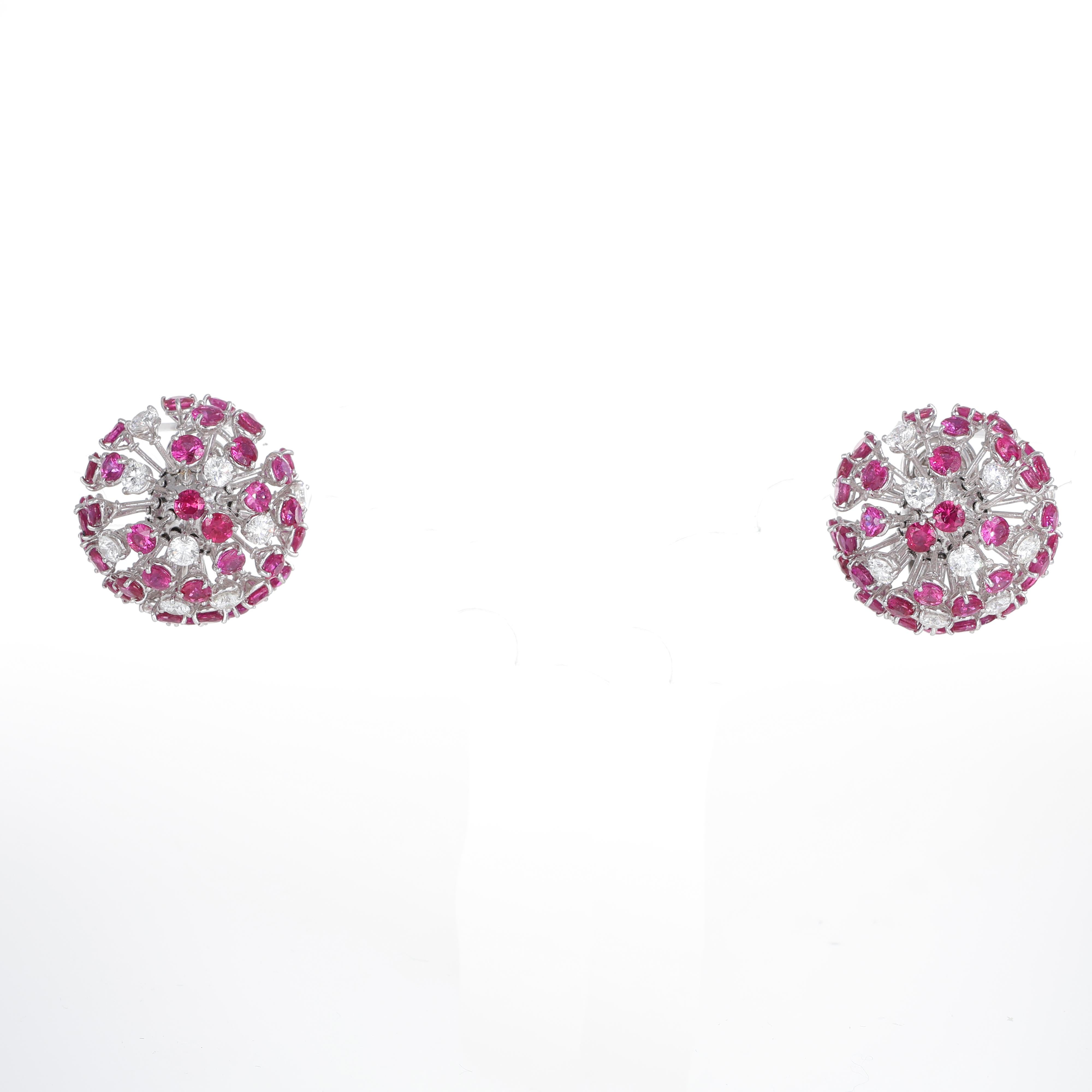 These exquisite earrings capture the delicate and airy beauty of a dandelion in bloom. Crafted in white gold, the intricate design mimics the organic structure of a dandelion puff, with an array of pink sapphires arranged in a three-dimensional