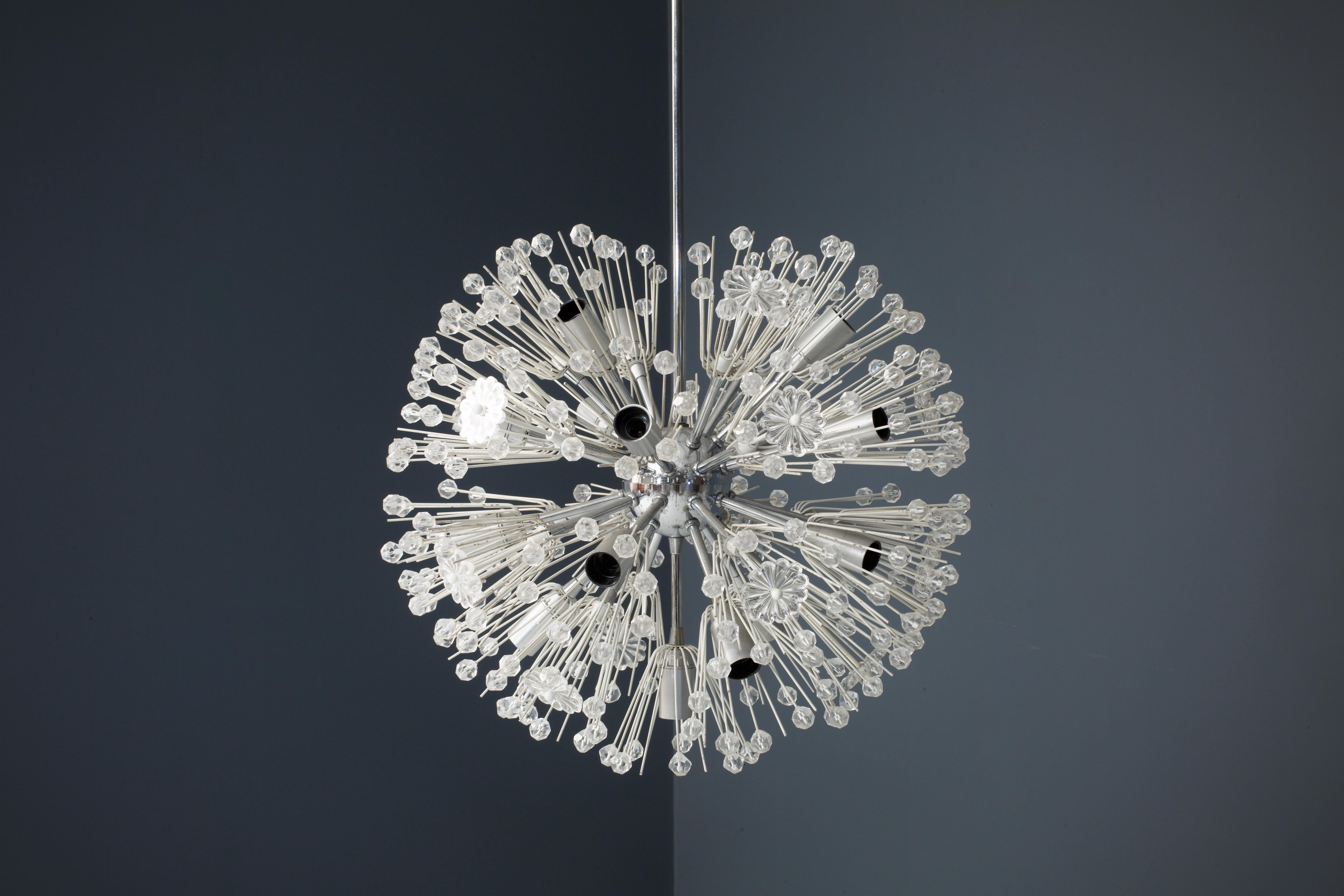 'Dandelion' Sputnik chandelier by Emil Stejnar, Vienna, Austria, 1955. Produced by Rupert Nikoll. This chandelier is made of faceted glass in the shapes of snowflakes. The Sputnik-like base, stem and ceiling cap are still intact and the contrasts
