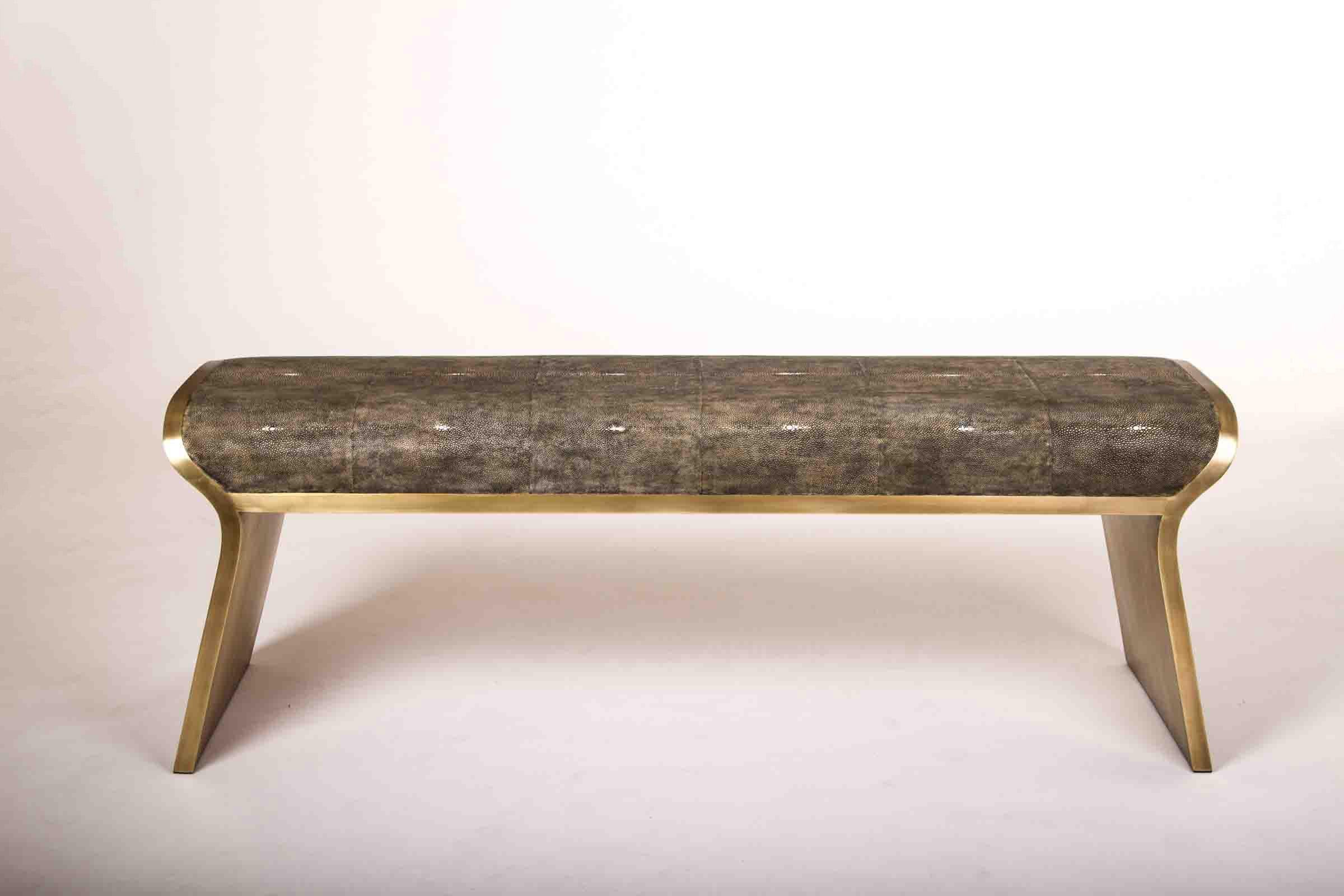The Dandy day bench is the ultimate luxury seating. The seating area is inlaid in cream shagreen and the frame and sides of the bench are completely inlaid in bronze-patina brass. A coal black shagreen version is available see image at end of slide.