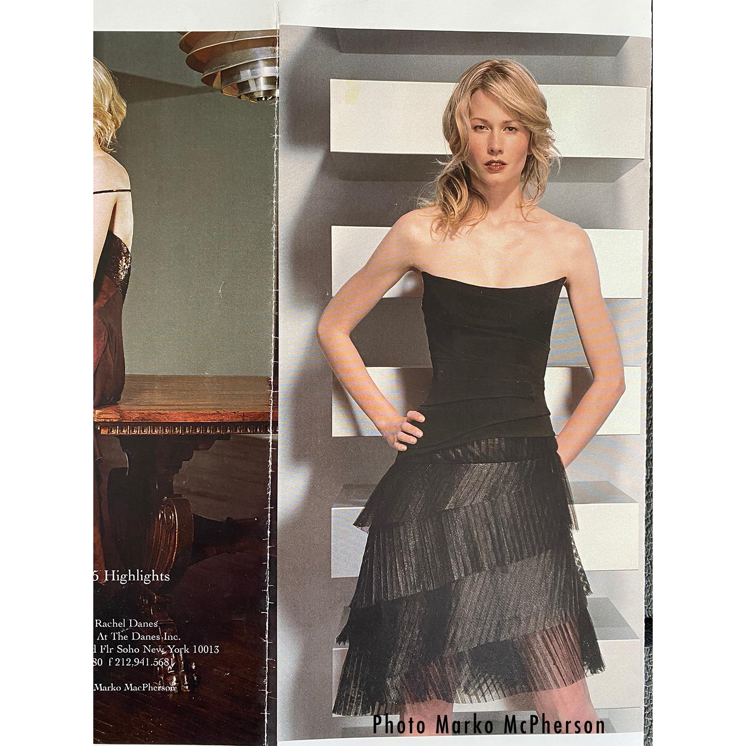 This Danes chocolate leather label designer black dress has so much style with its fitted black knit bodice with thin spaghetti straps, and dramatic pleated metallic tulle asymmetrical skirt!  This is such a perfect cocktail dress and it is in