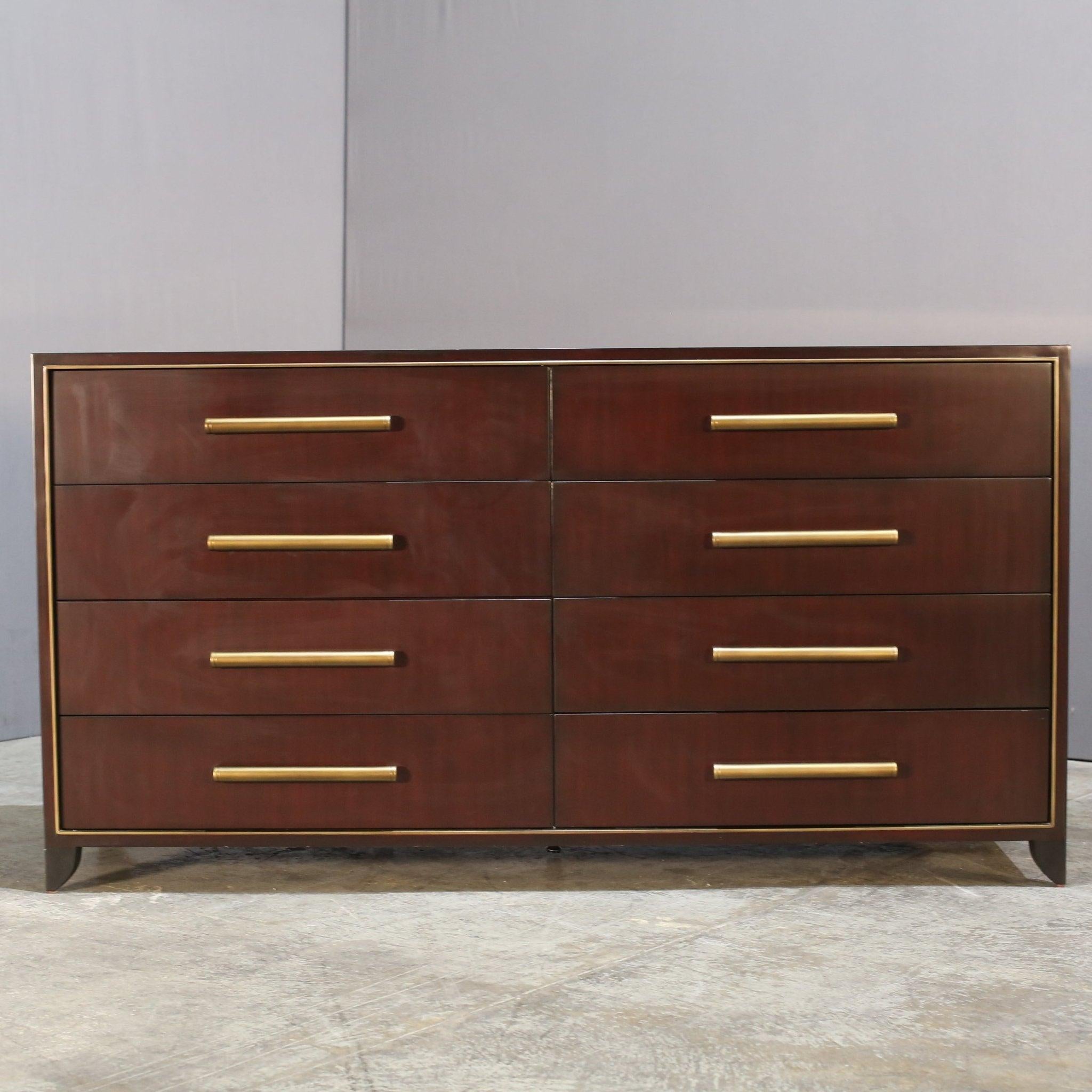 Introducing the exquisite Danese Cabinet by renowned designer Christopher Guy. This stunning piece features a sleek and sophisticated design, crafted from the finest materials to elevate any living space. The cabinet boasts intricate hand-carved