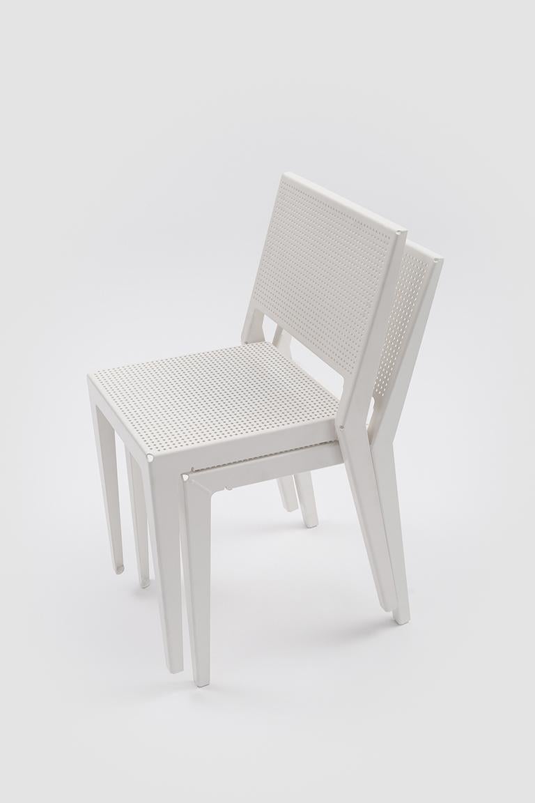 Abchair is a stackable seat made from a single sheet of anodized aluminium. The structure is made of two laser-cut parts that are that are shaped like teeth of a comb. These are then bent and finally joined together using as little welding as