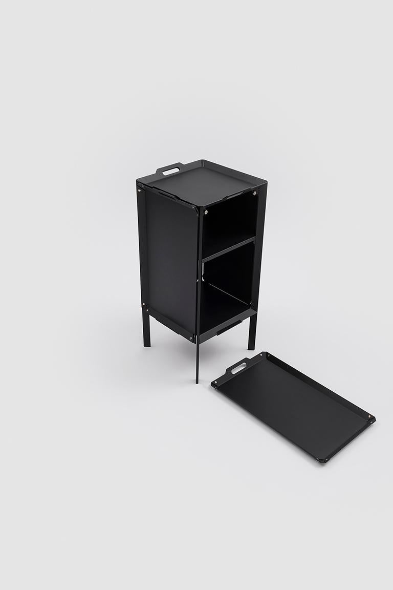 Double life is a small, transformable storage cabinet that harks back to the coffee tables of the 18th Century. It is a simple structure with three shelves and a back. The three open sides are closed using aluminium trays that are fixed to the