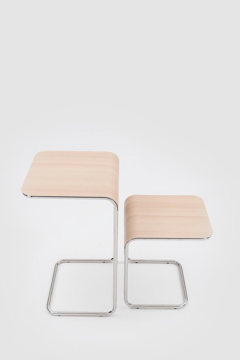 Farallon Side Table is a linear low table whose versatility allows it to interact with a diverse range of styles and surroundings. The main structure has the same form and is made with the same technique as the Farallon chairs. The form of the thin