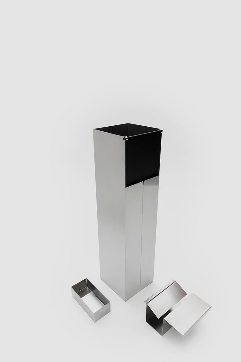 Levanzo is a standing floor ashtray with built in rubbish bin in satin finished stainless steel and anodized aluminium.

Bruno Munari was one of the most important Italian architects, artists and designers of the 20th Century. Born in Milan in