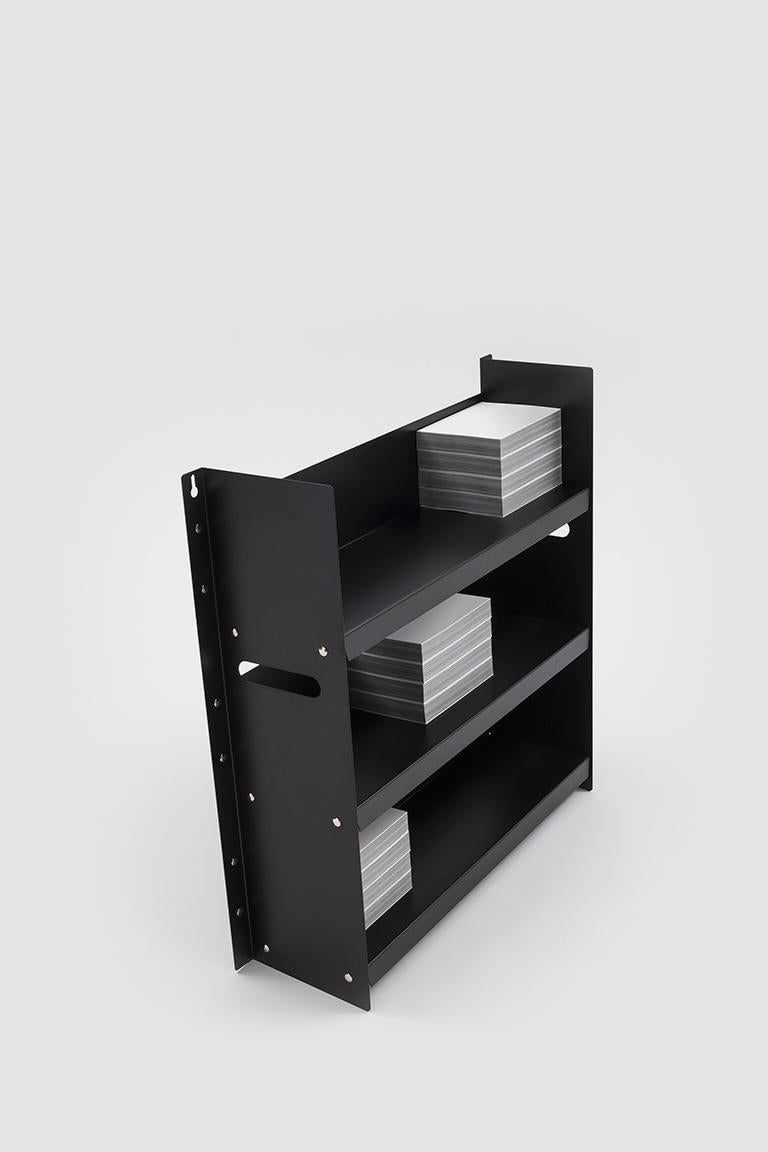 Black Livorno 60 is a small bookcase with three shelves made in powder-coated metal. The design of the piece is minimal and is characterized by the simplicity of the form and materials used.

Marco Ferreri is an architect who is capable of