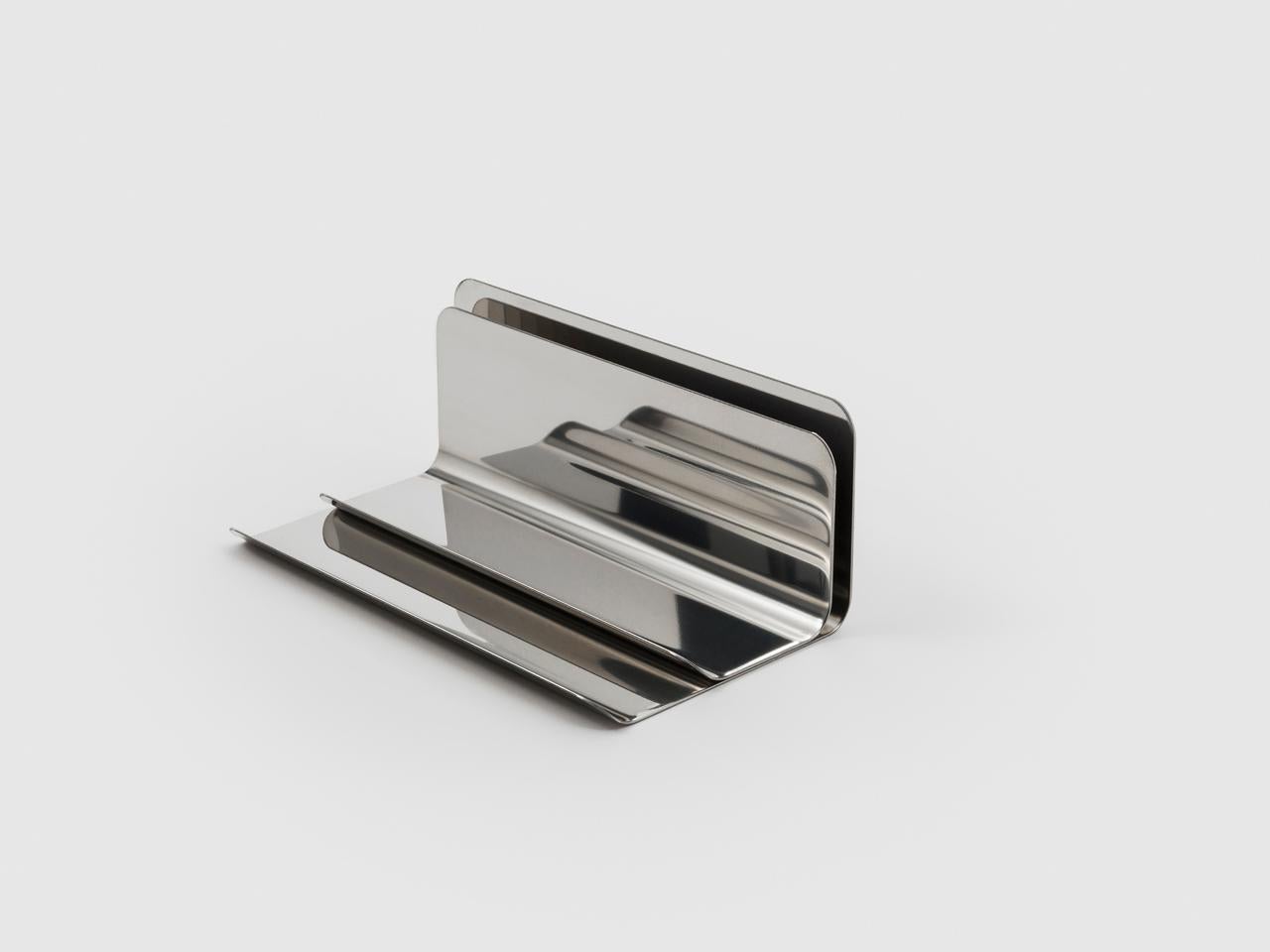 Ventotene is a lettertray and pencil holder rolled into one. It combines both design and functionalism in one useful and attractive everyday object made of polished stainless steel.

Enzo Mari is one of the masters of Italian Design. He was born